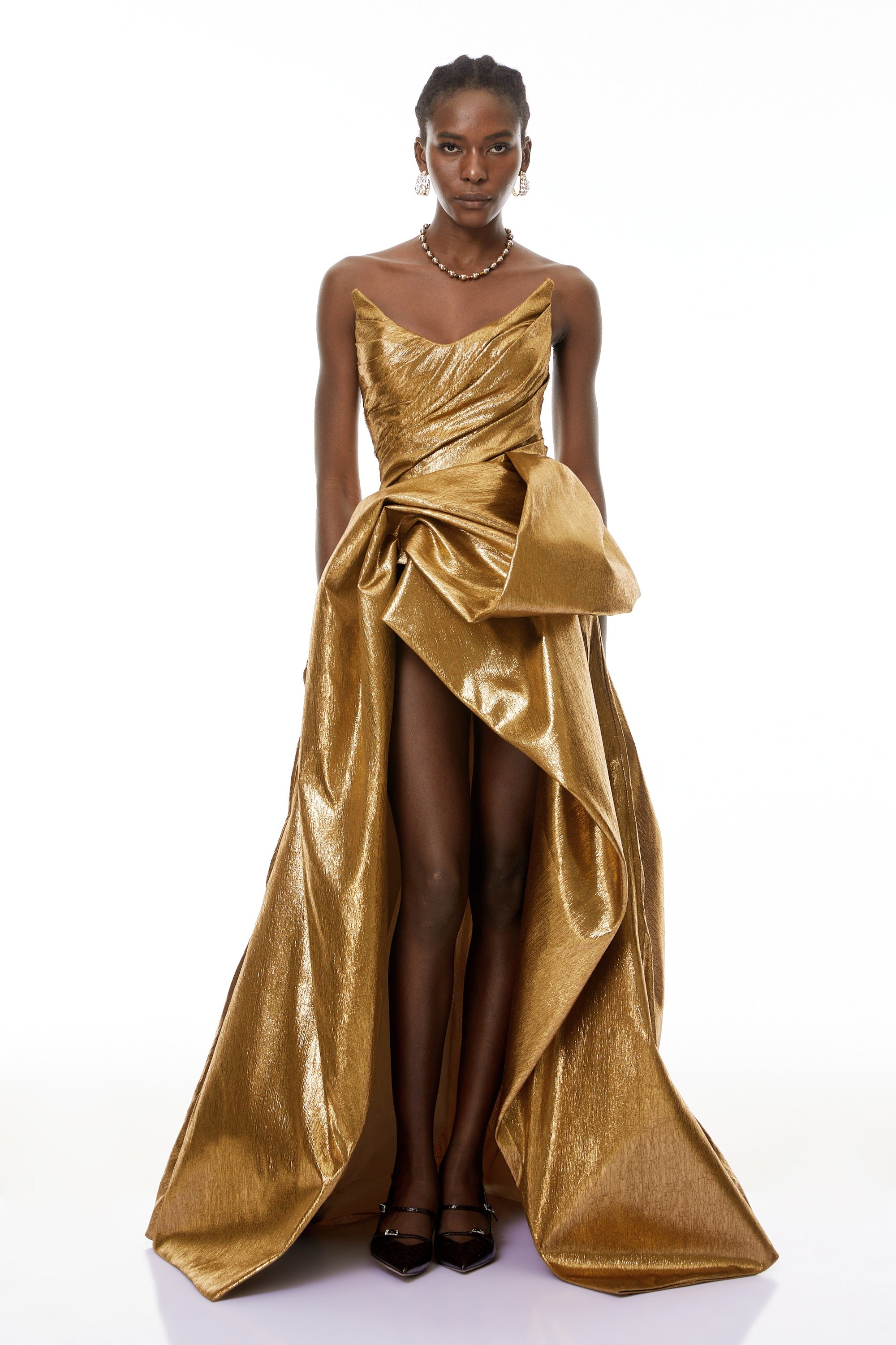 Metallic gold strapless gown with high slit
