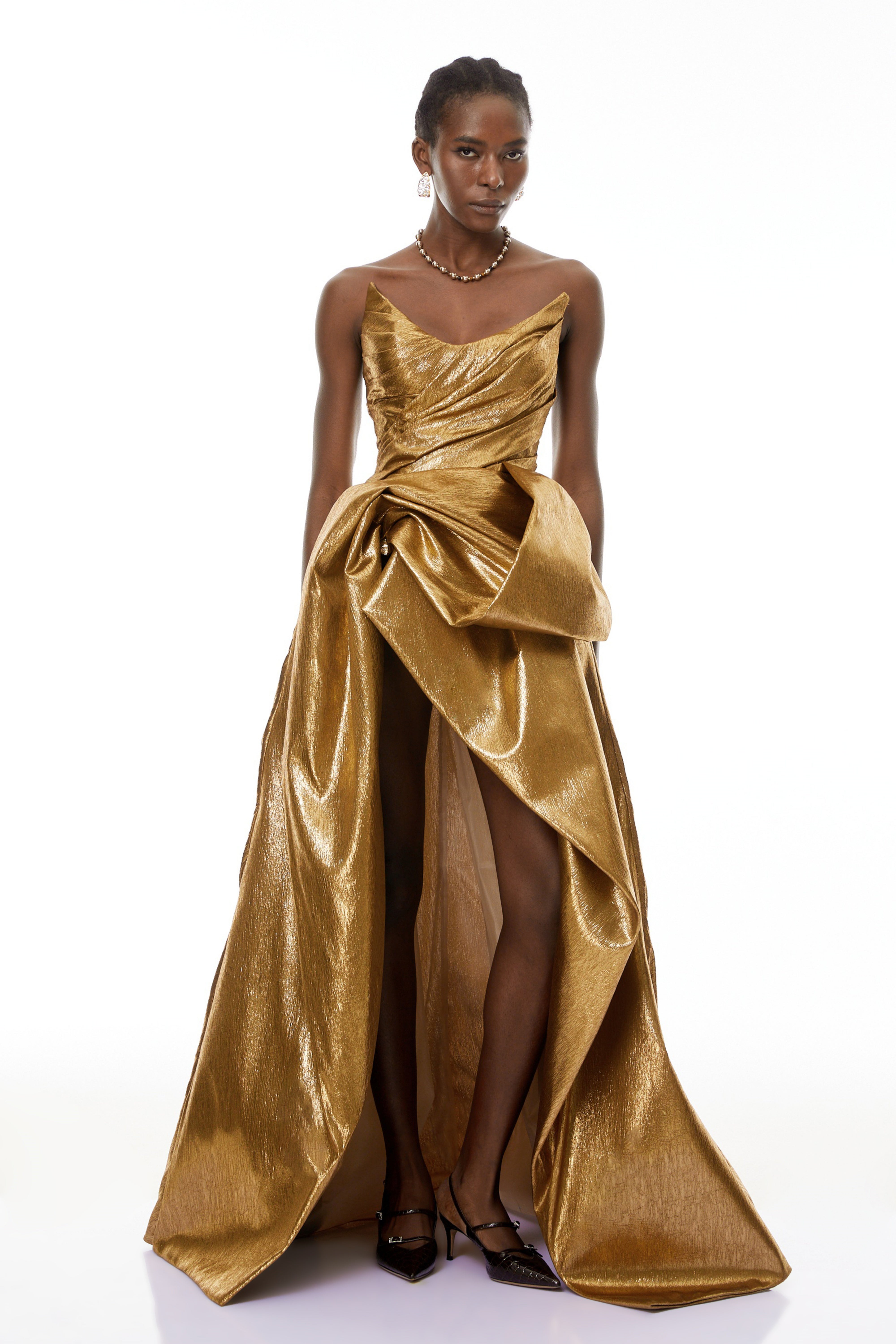 Metallic gold strapless gown with high slit