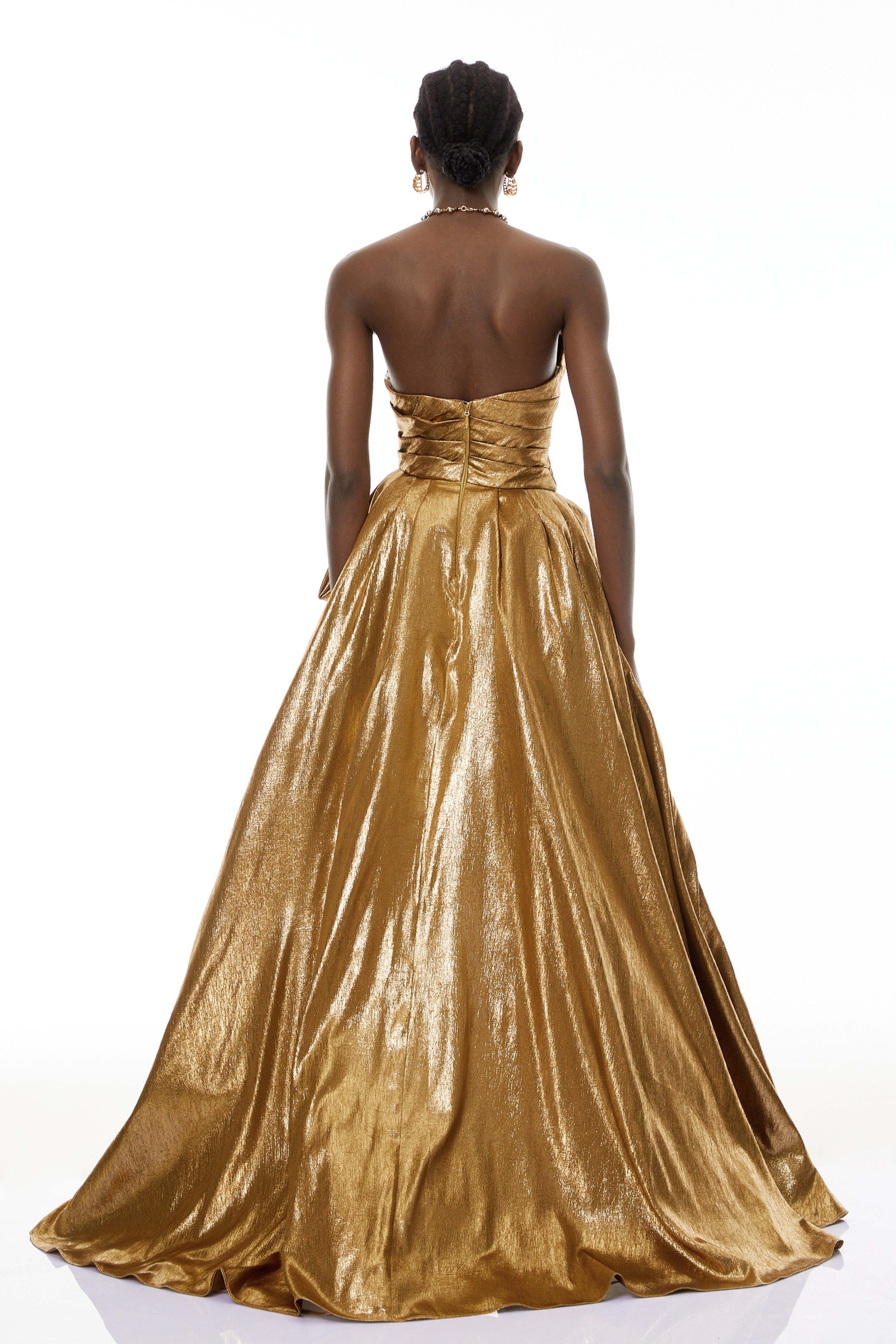 Metallic gold strapless gown with high slit