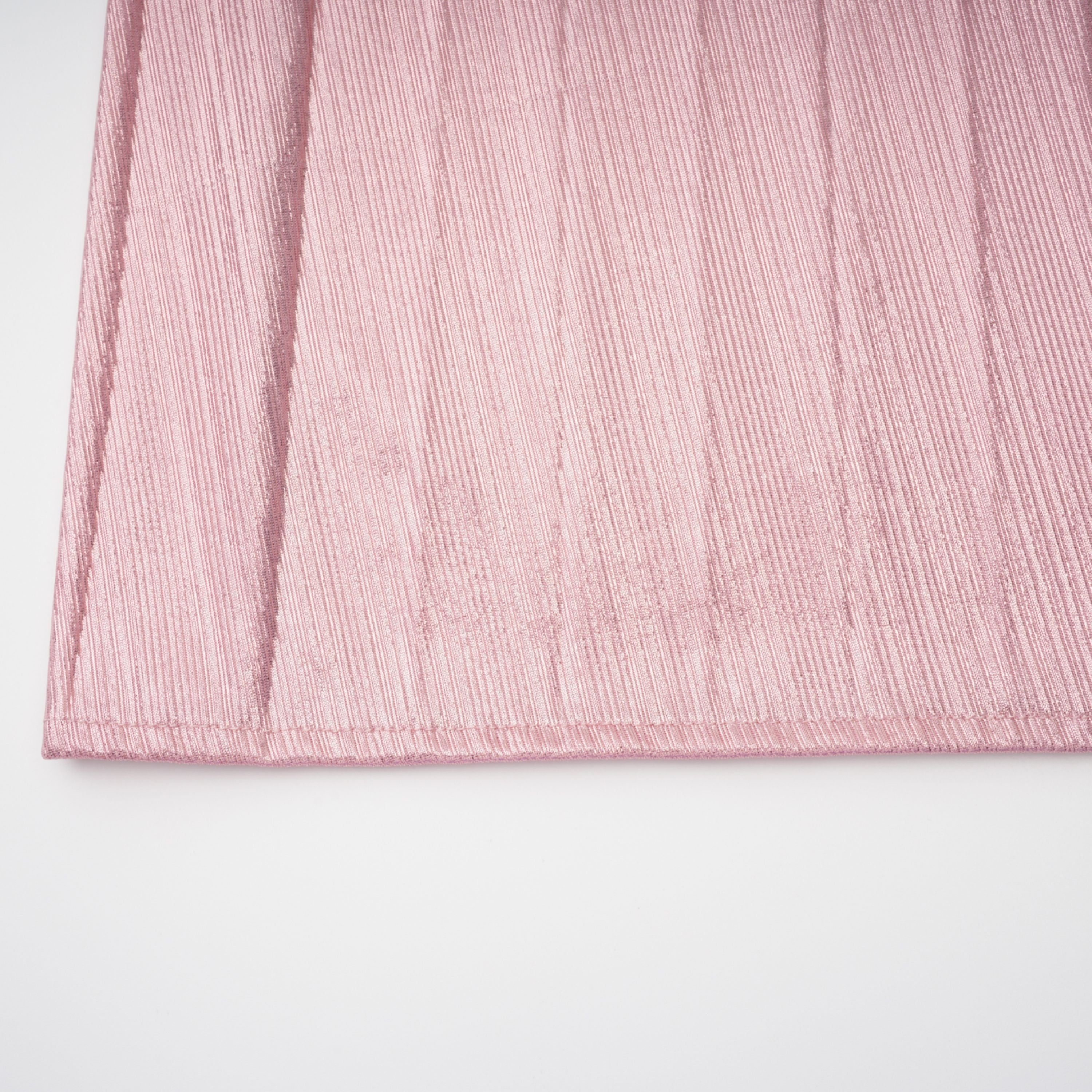 Metallic rose pink pleat halter gown with a cinched waist and high leg slit