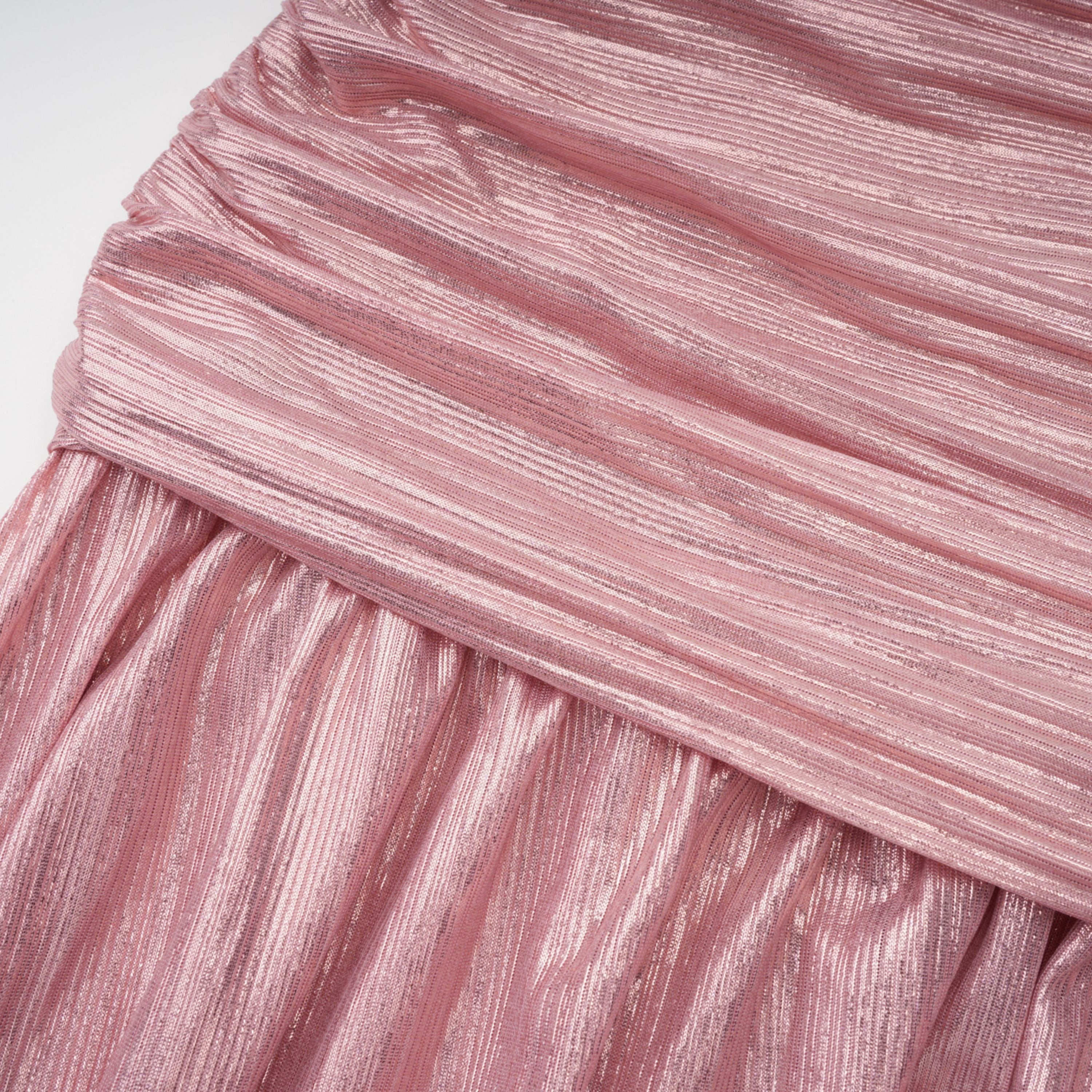 Metallic rose pink pleat halter gown with a cinched waist and high leg slit