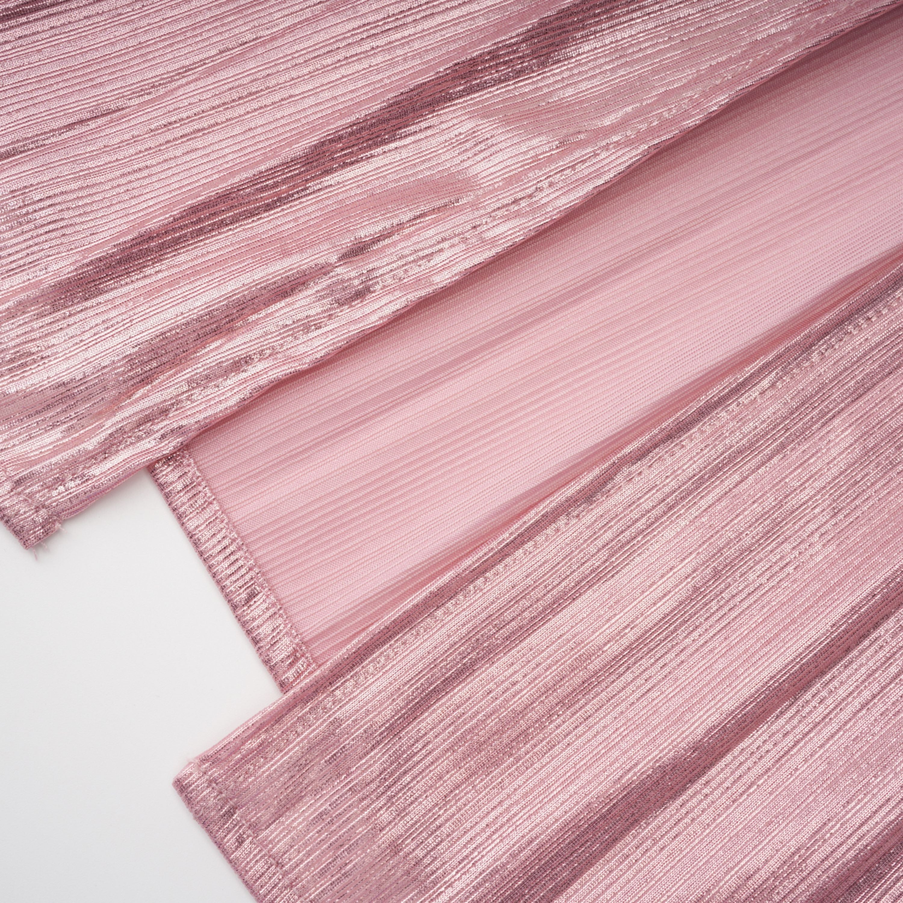 Metallic rose pink pleat halter gown with a cinched waist and high leg slit