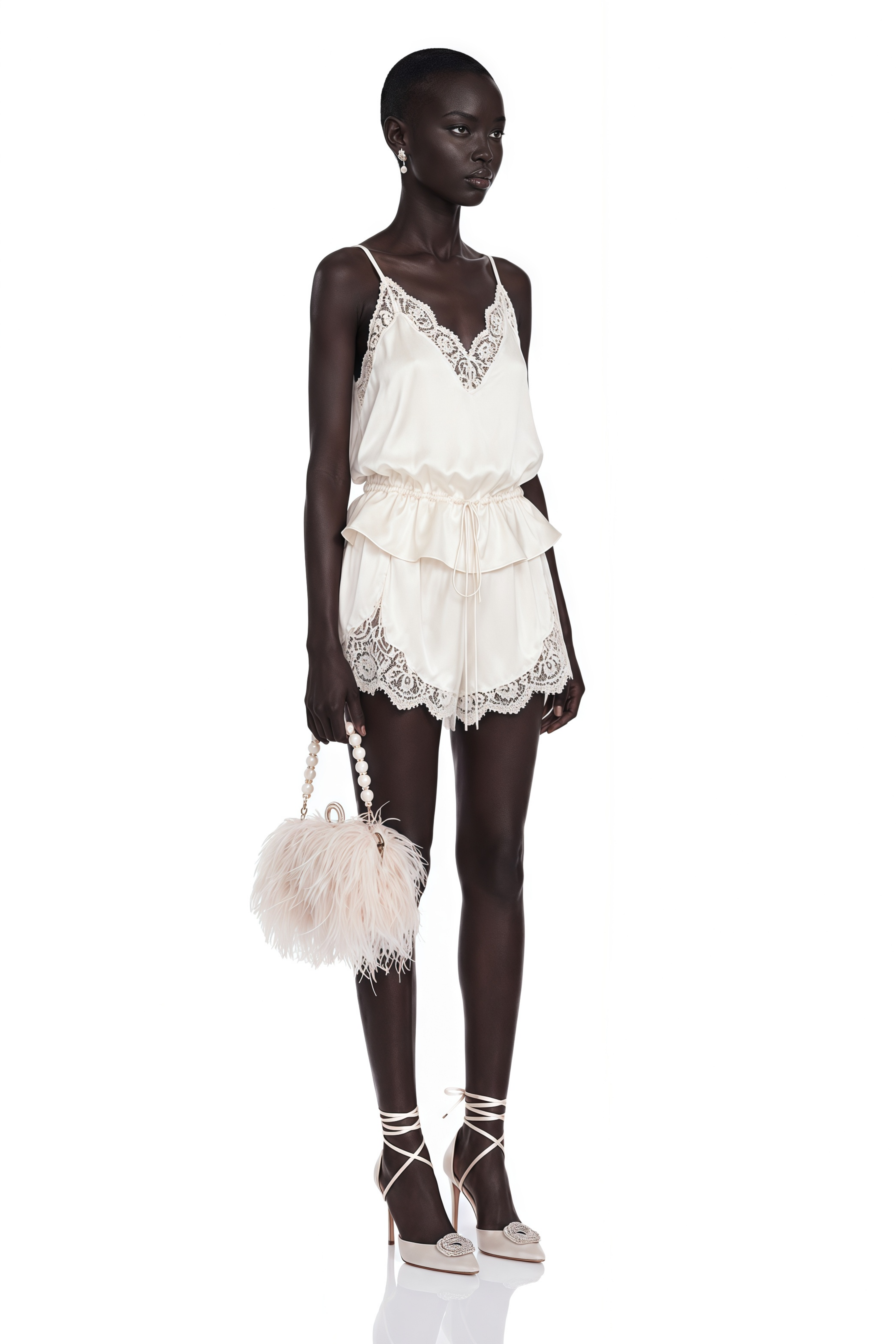 Off-white satin camisole and shorts pajama set with lace trim