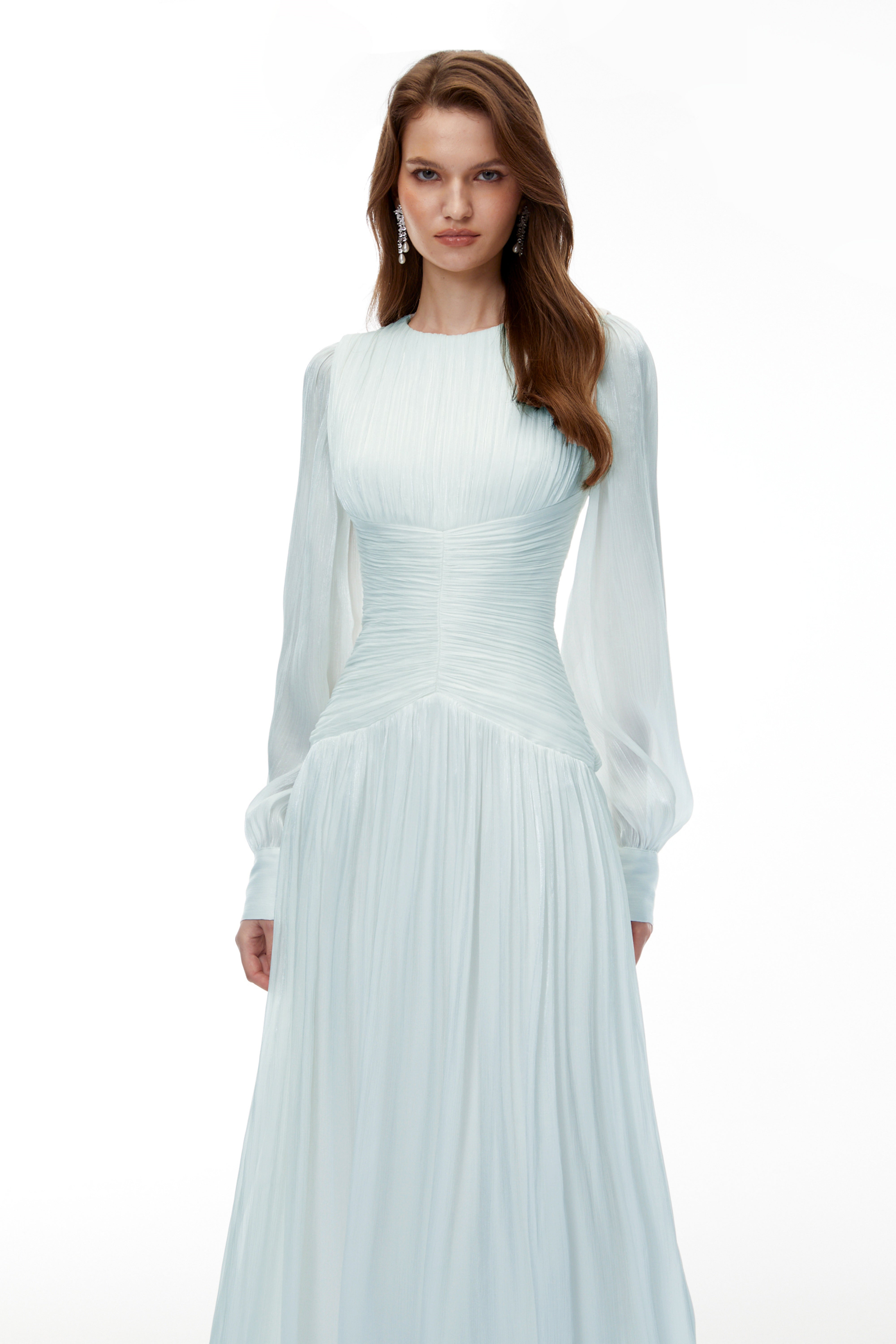 Light green maxi dress with a ruched bodice, round neckline, and long sheer sleeves
