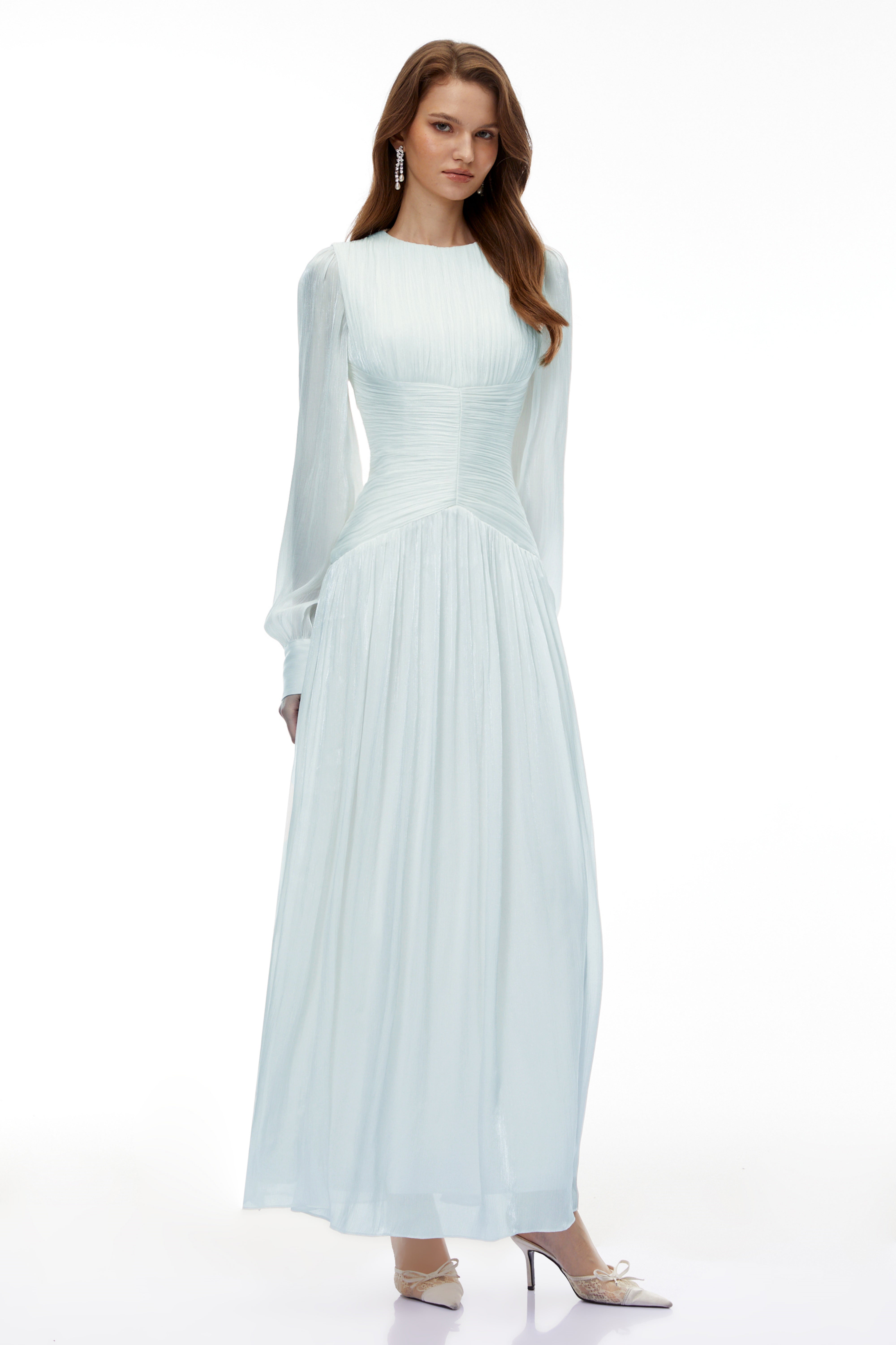 Light green maxi dress with a ruched bodice, round neckline, and long sheer sleeves