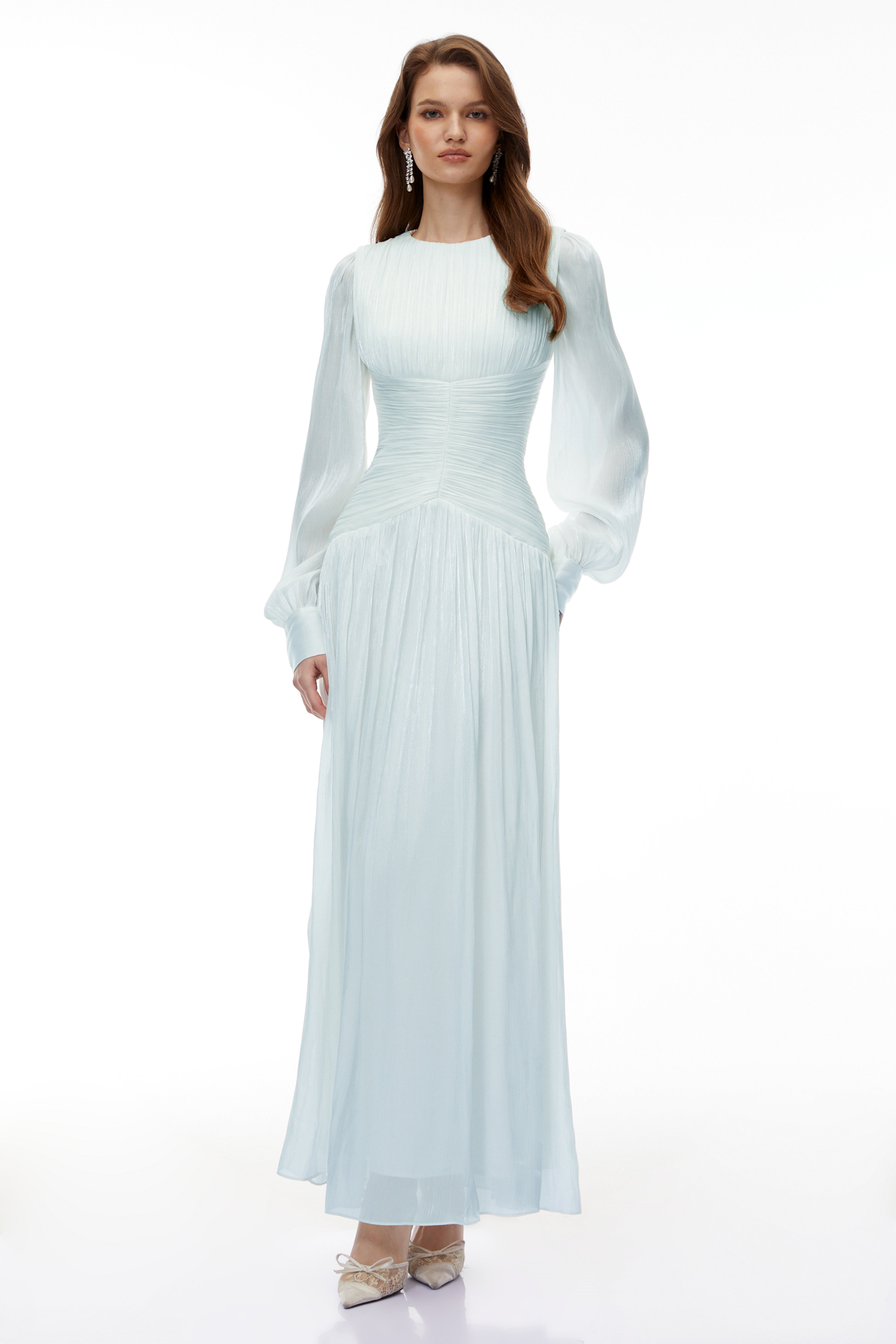 Light green maxi dress with a ruched bodice, round neckline, and long sheer sleeves