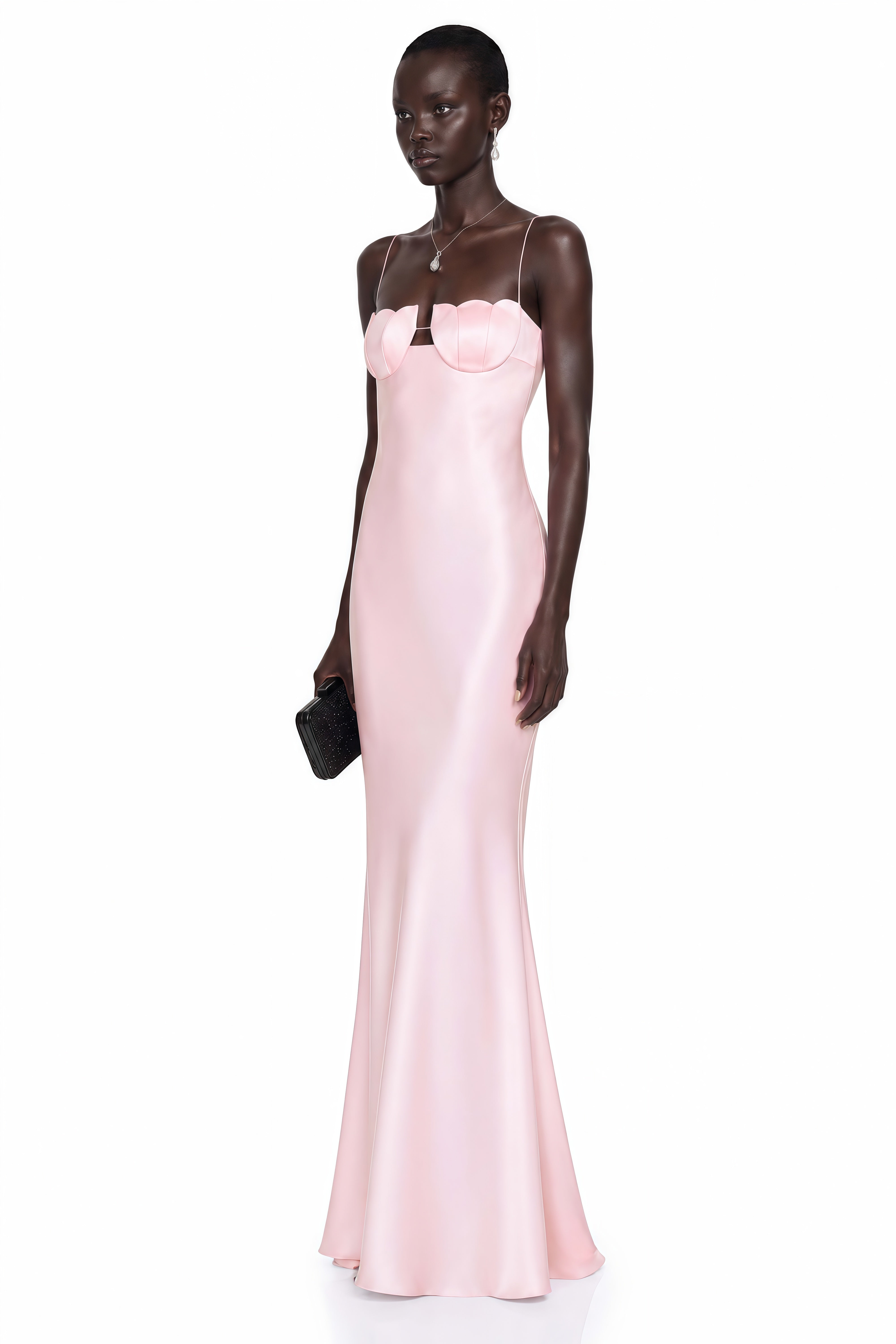 Pink satin slip maxi dress featuring a sculpted seashell-style bustier and thin spaghetti straps