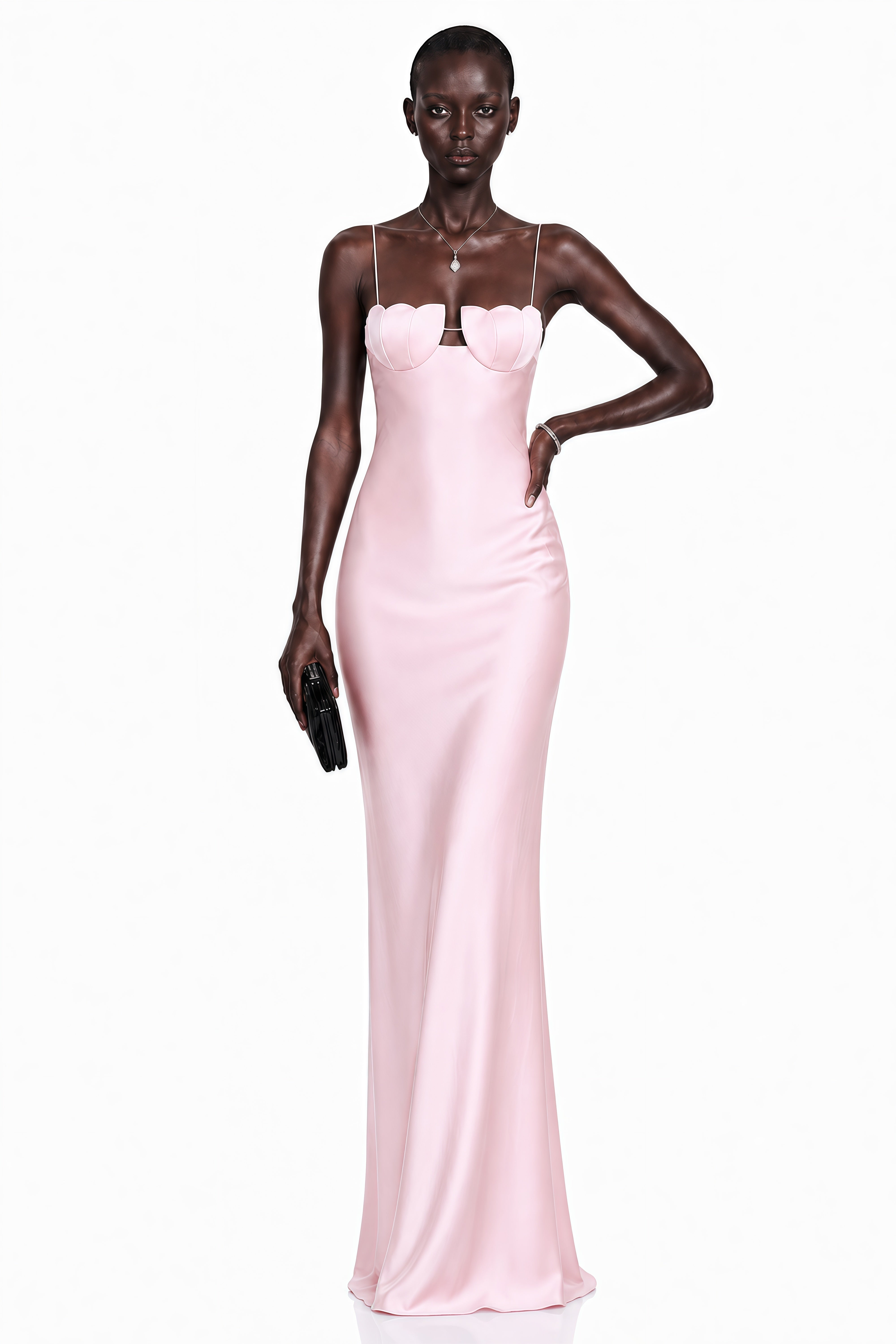 Pink satin slip maxi dress featuring a sculpted seashell-style bustier and thin spaghetti straps