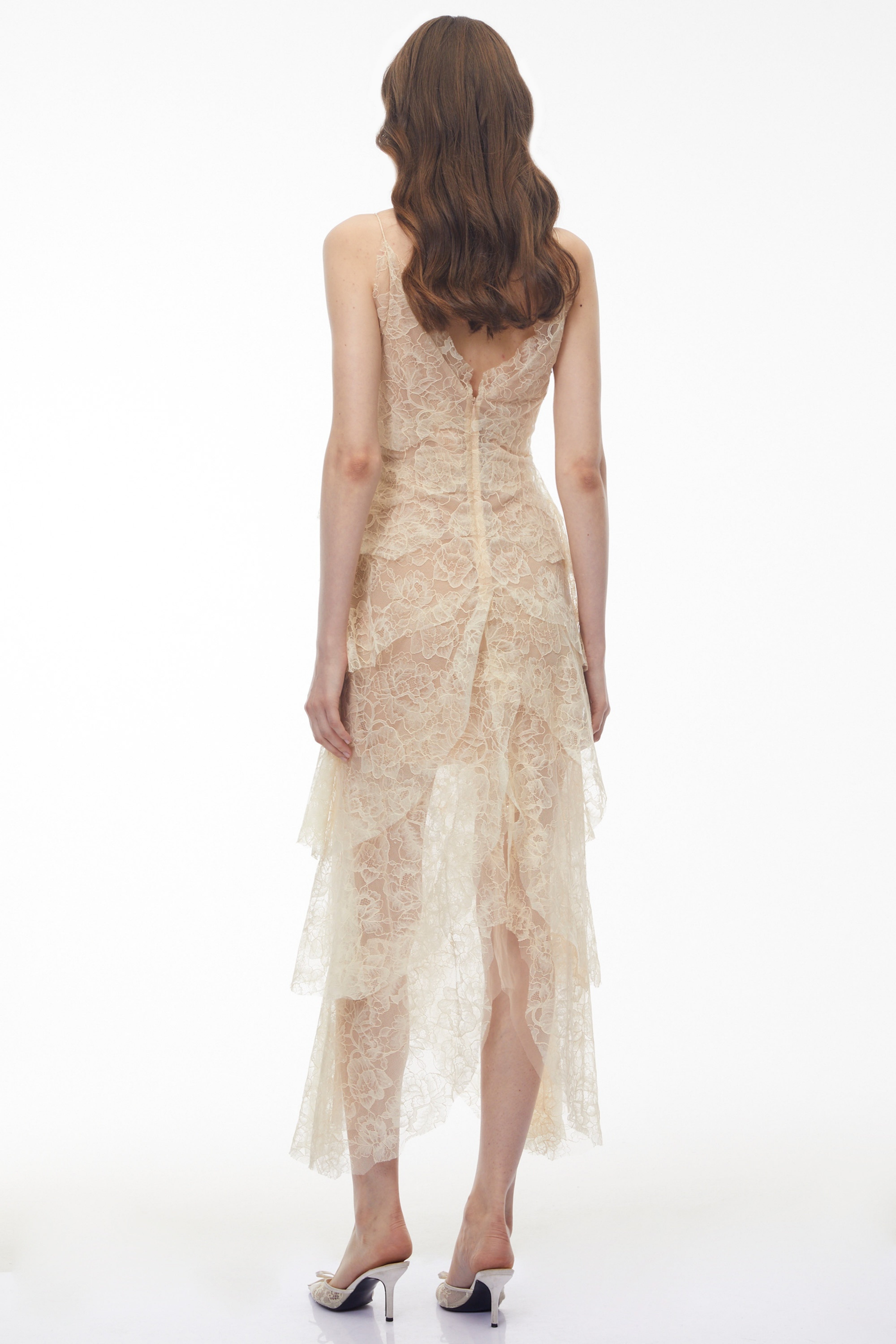 Cream tiered lace maxi dress with small black bow accents