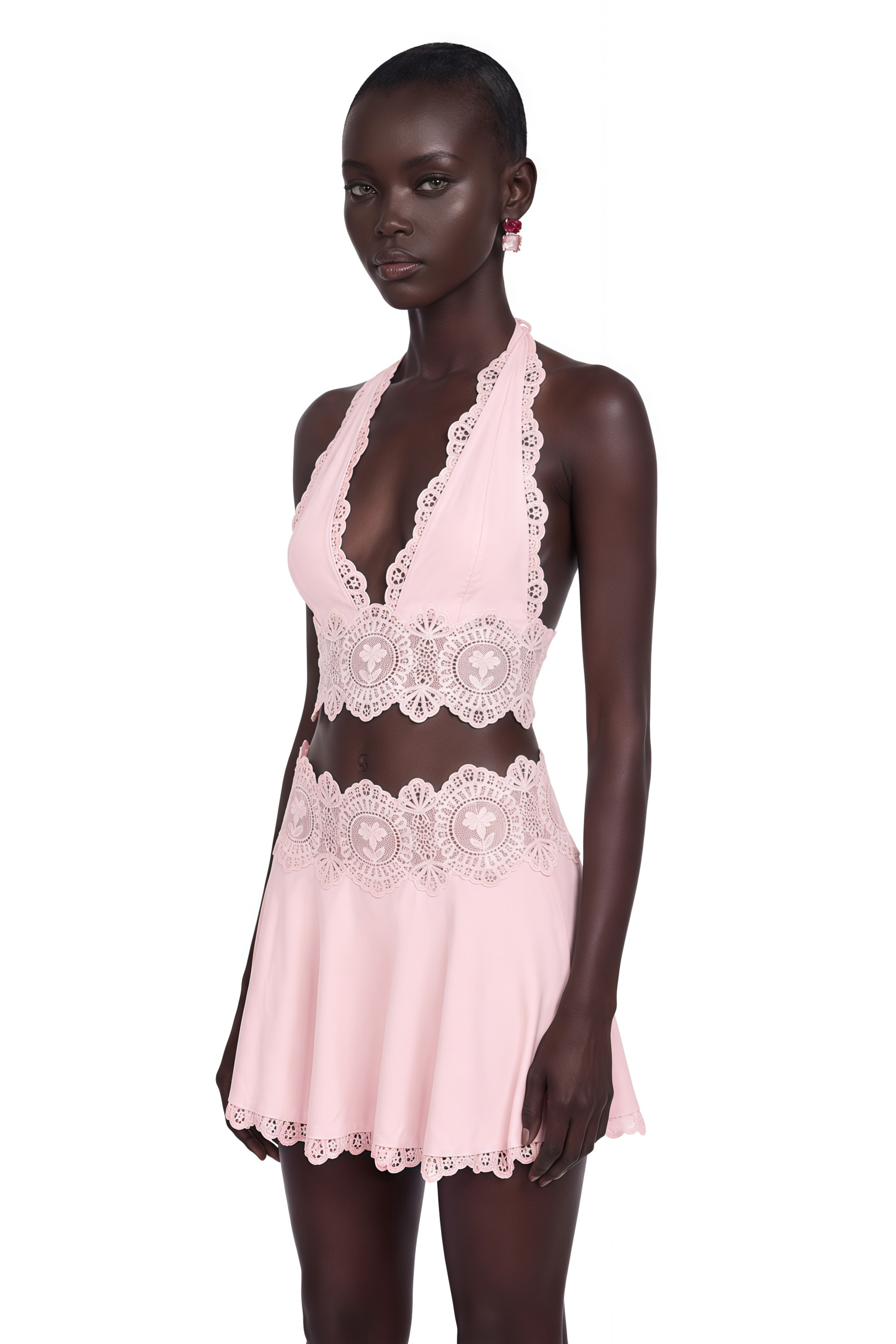Light pink halter crop top and mini skirt set with lace details