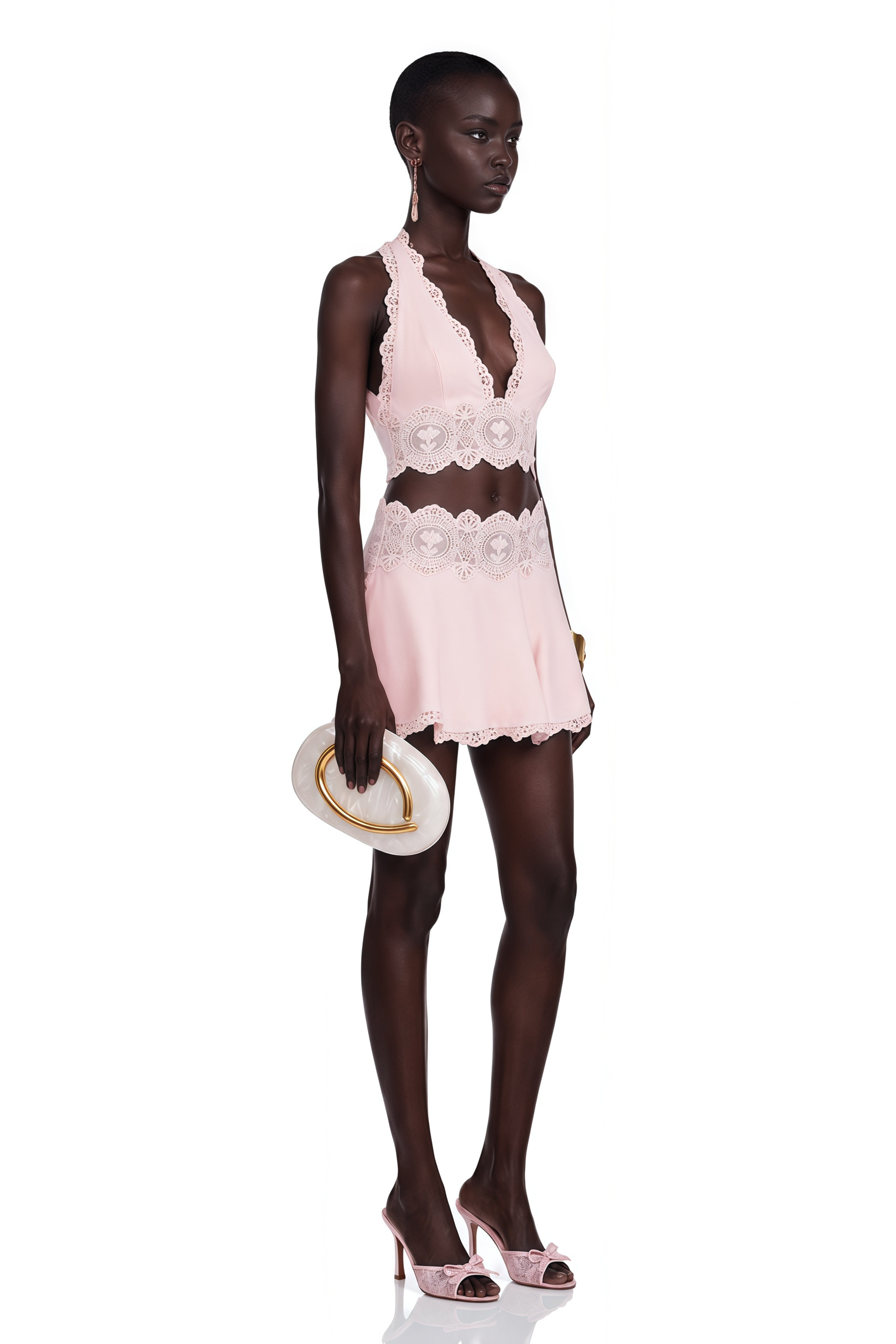 Light pink halter crop top and mini skirt set with lace details