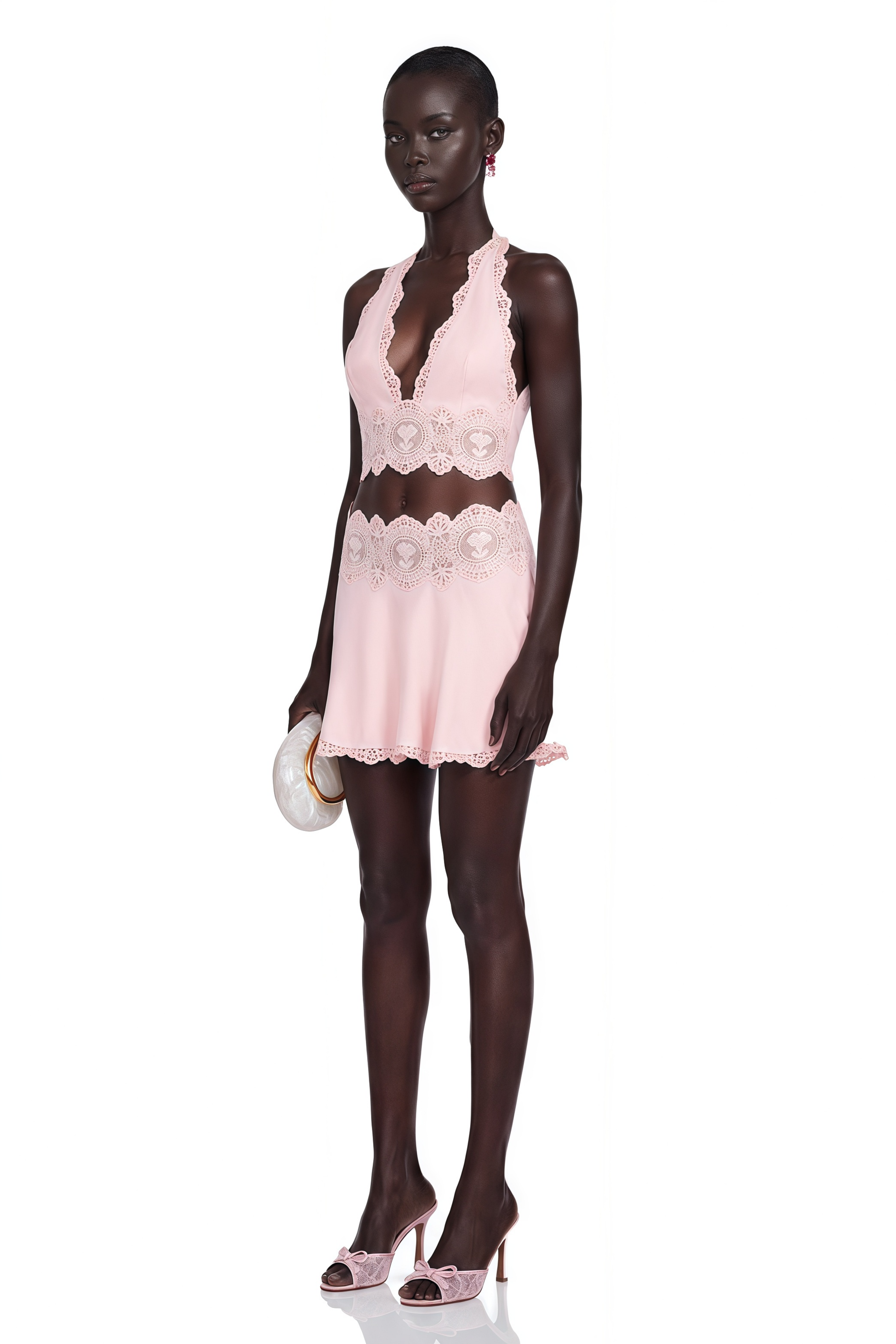 Light pink halter crop top and mini skirt set with lace details