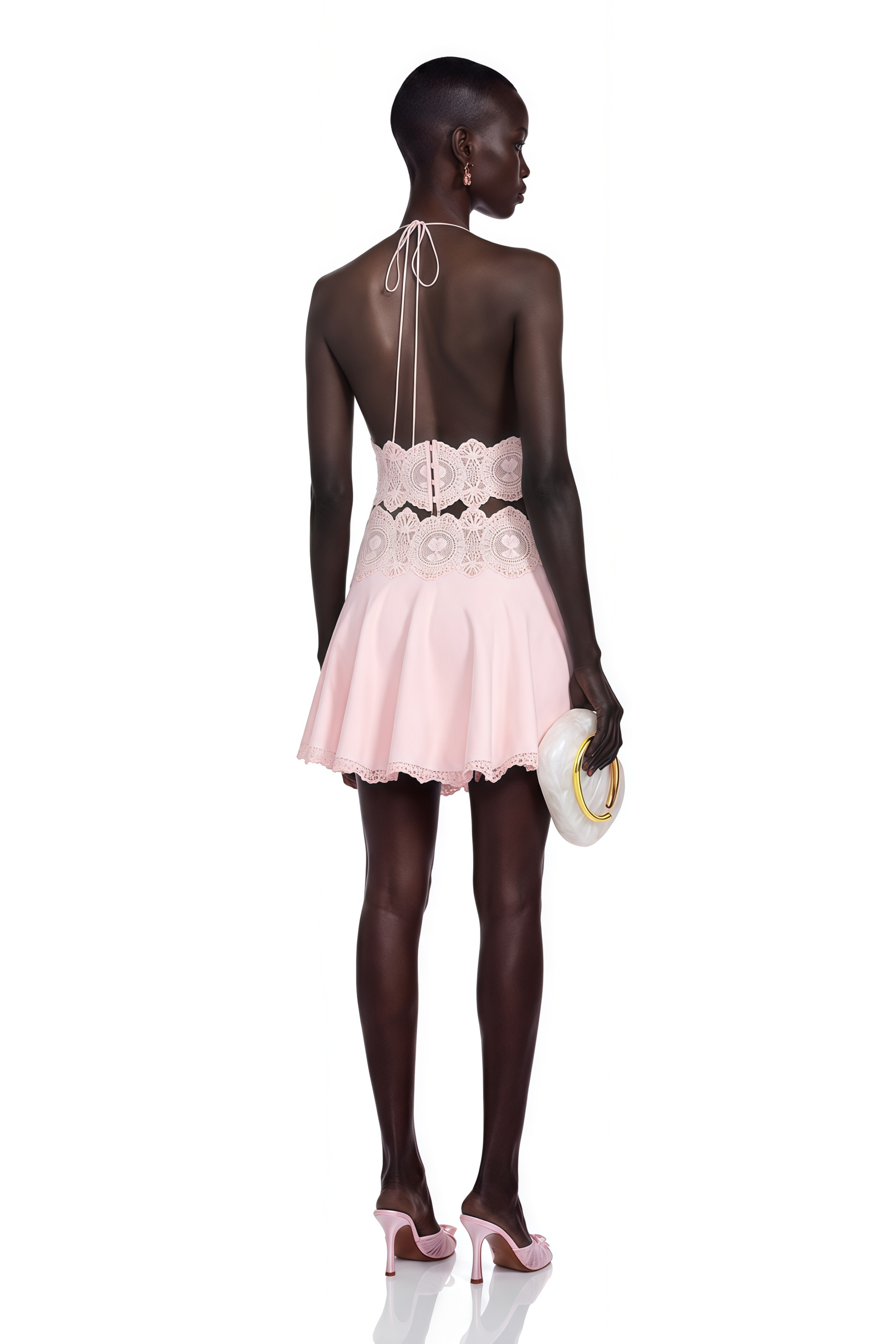 Light pink halter crop top and mini skirt set with lace details