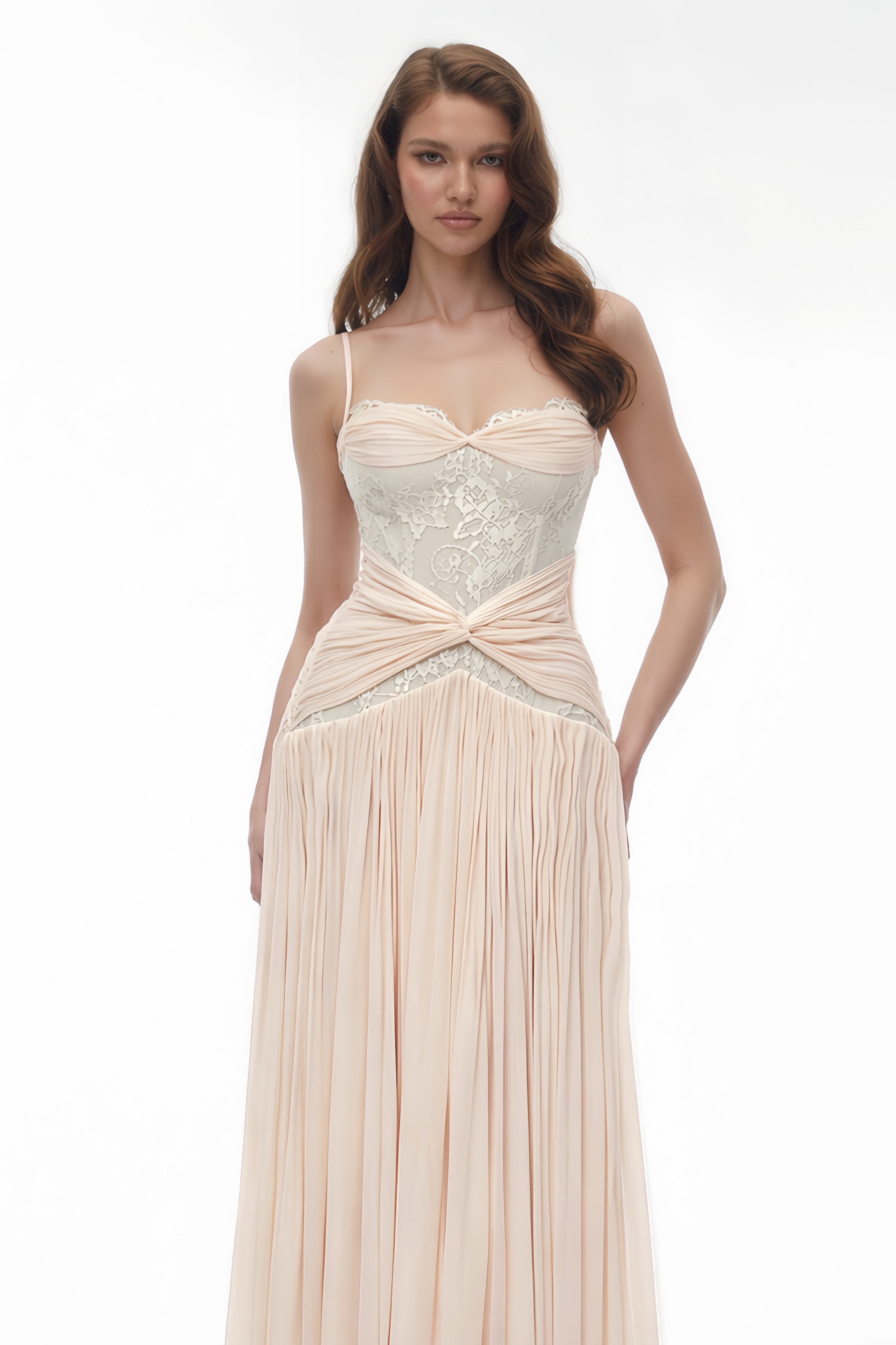 Light pink maxi dress featuring a sheer white lace corset bodice, a draped twist waistband, and a finely pleated skirt