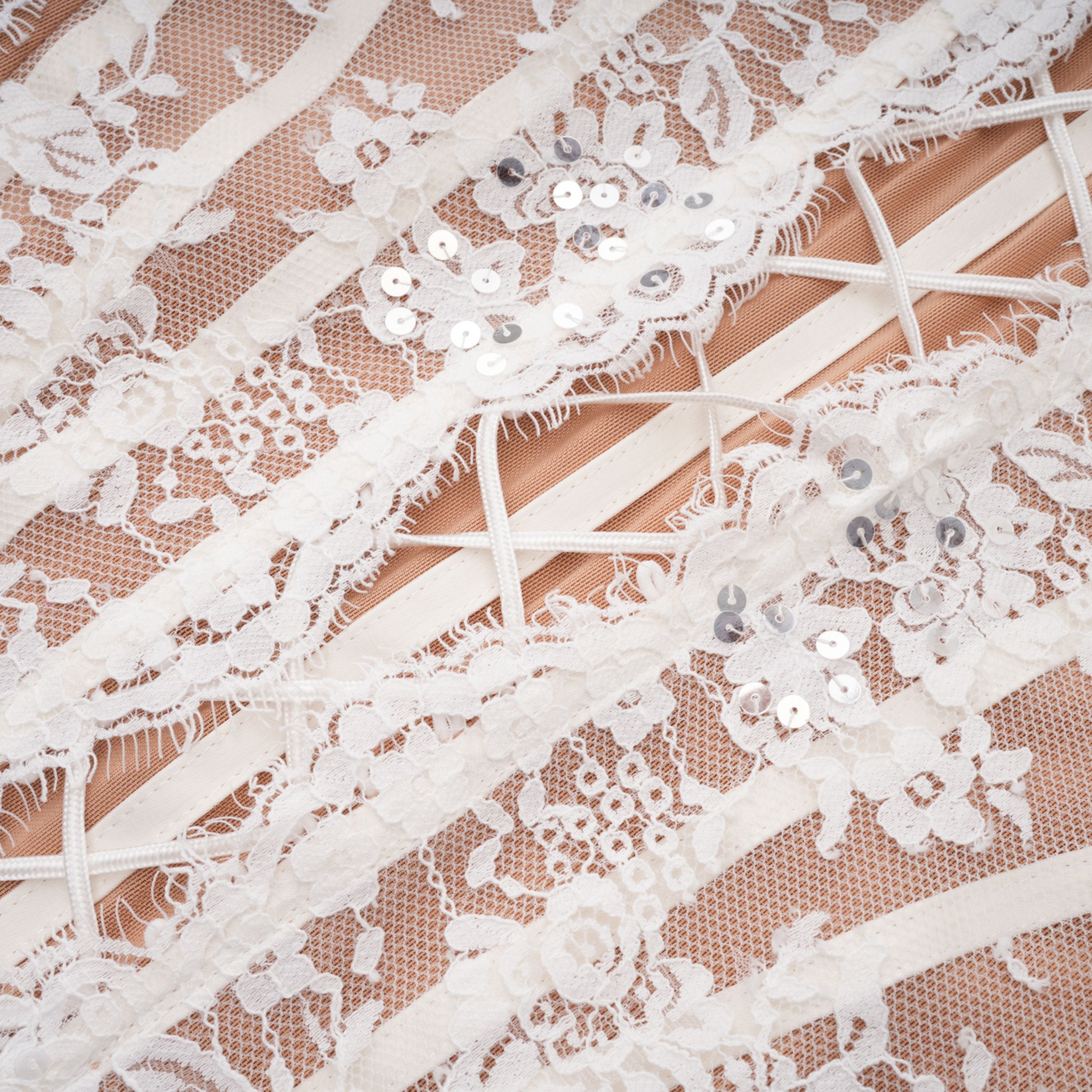 White lace corset-style mini dress with bell sleeves