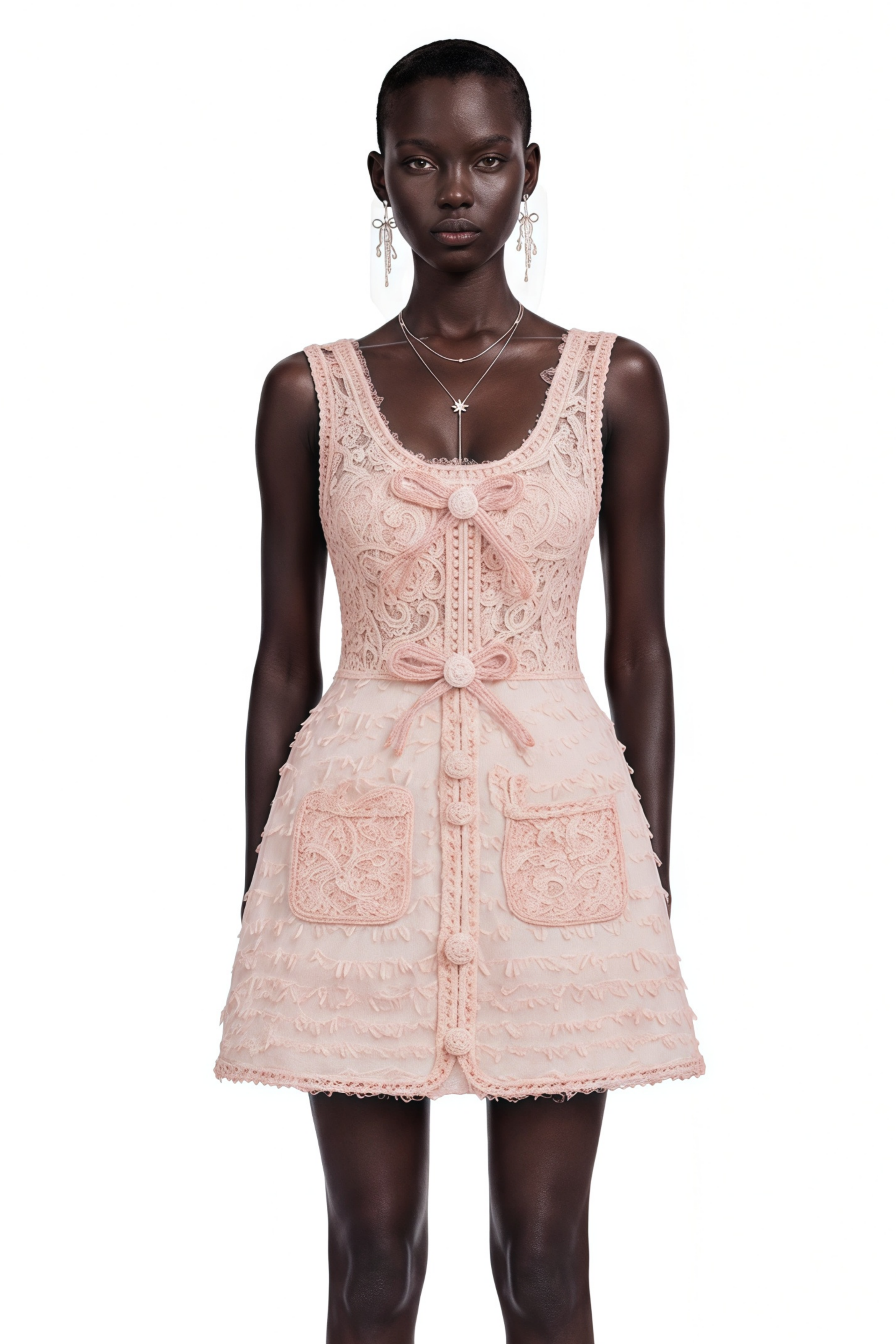 Light pink tweed cropped jacket and matching button-front mini skirt