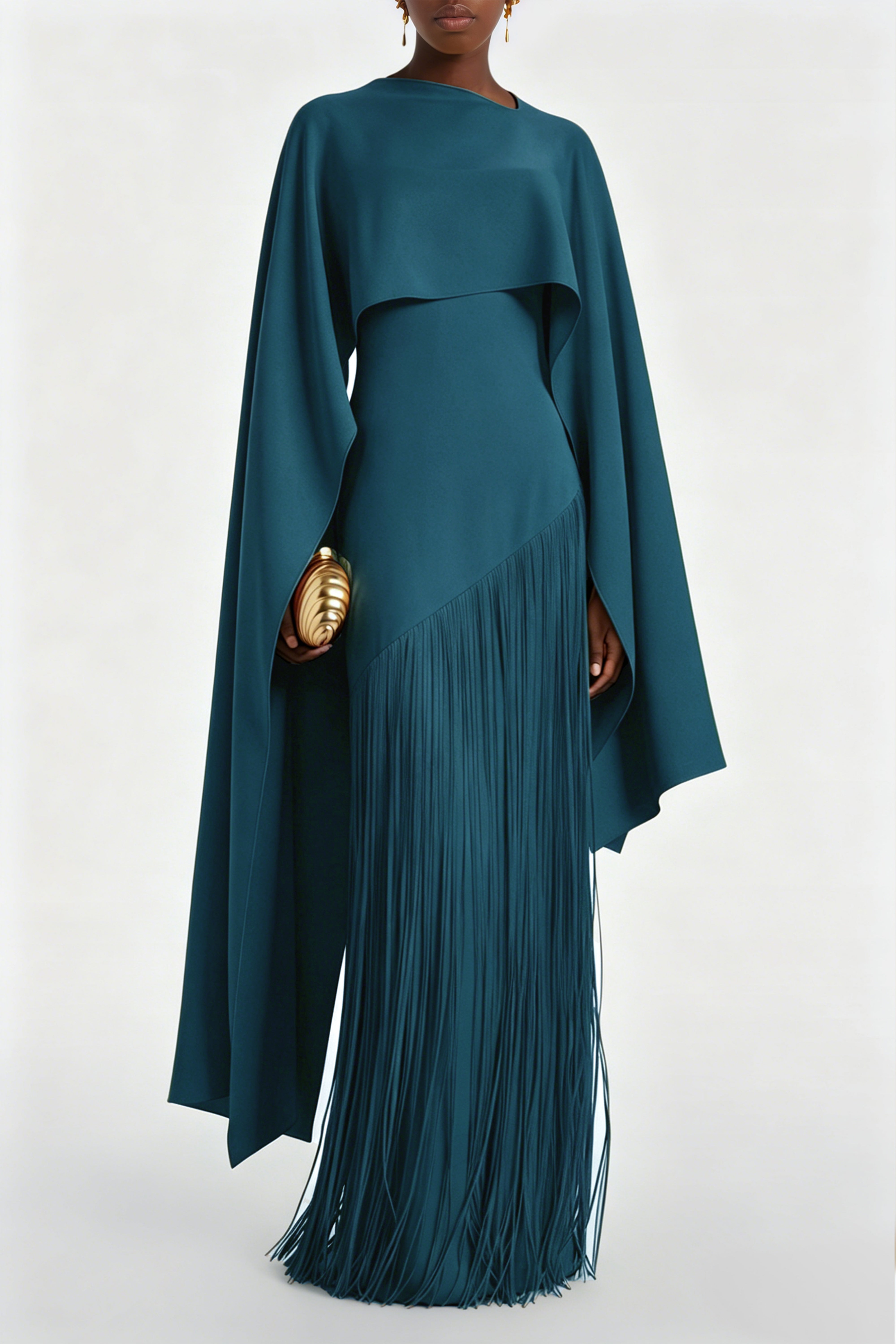 Teal blue maxi dress with a matching overlay cape and a long asymmetric fringe skirt
