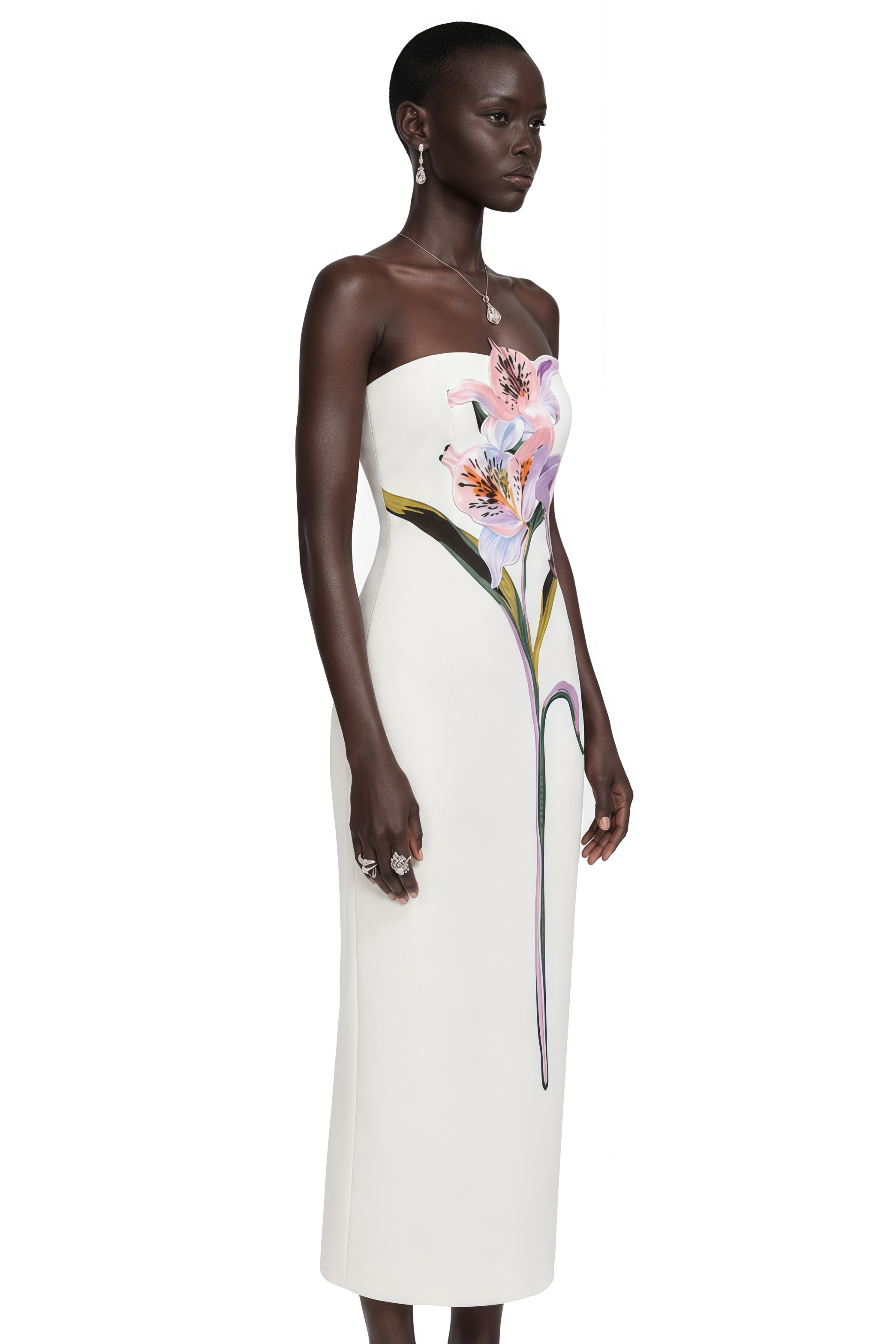 White strapless column gown with a large painted floral graphic