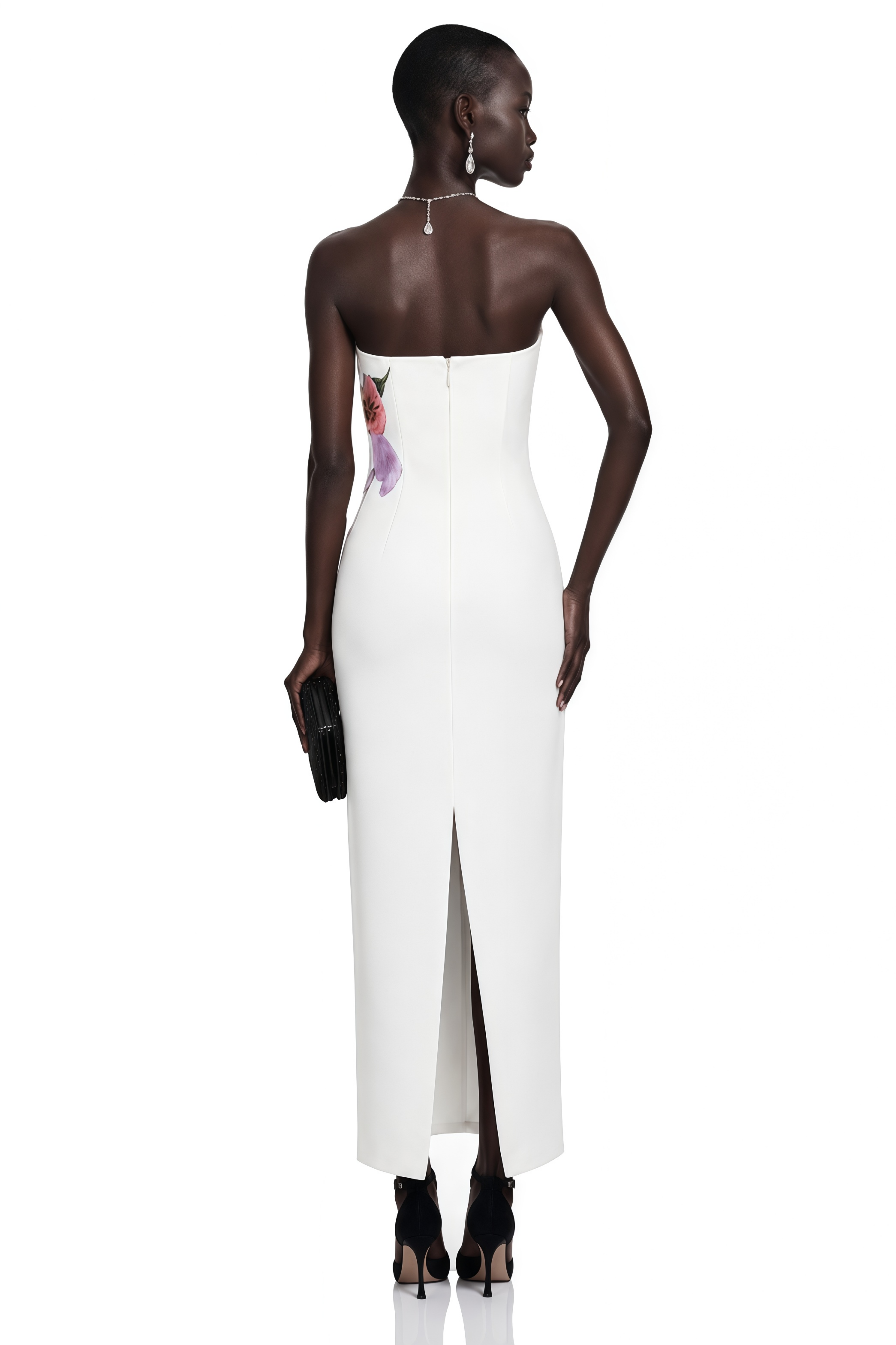 White strapless column gown with a large painted floral graphic