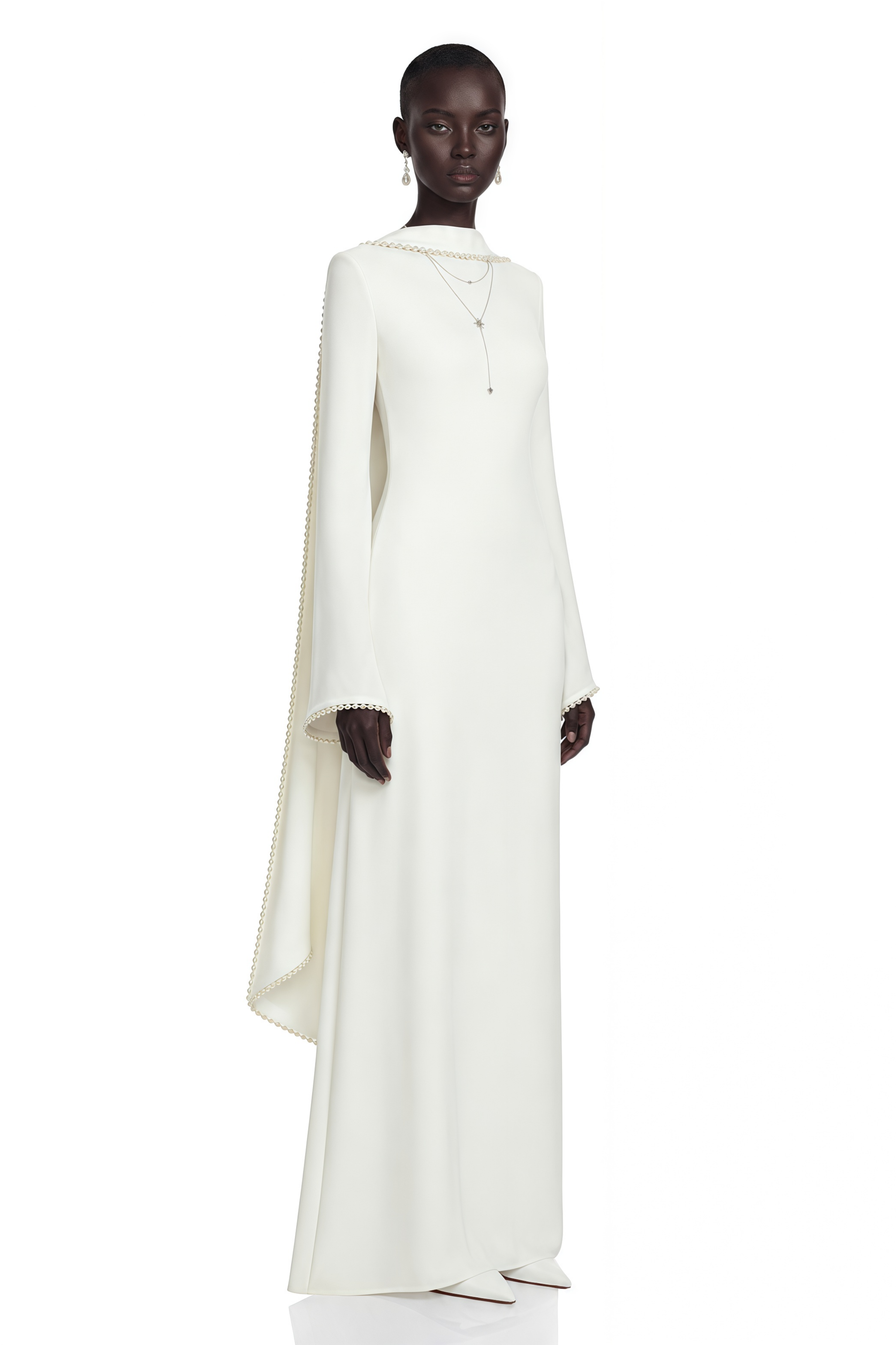 White long-sleeve gown with a high neckline and pearl trim