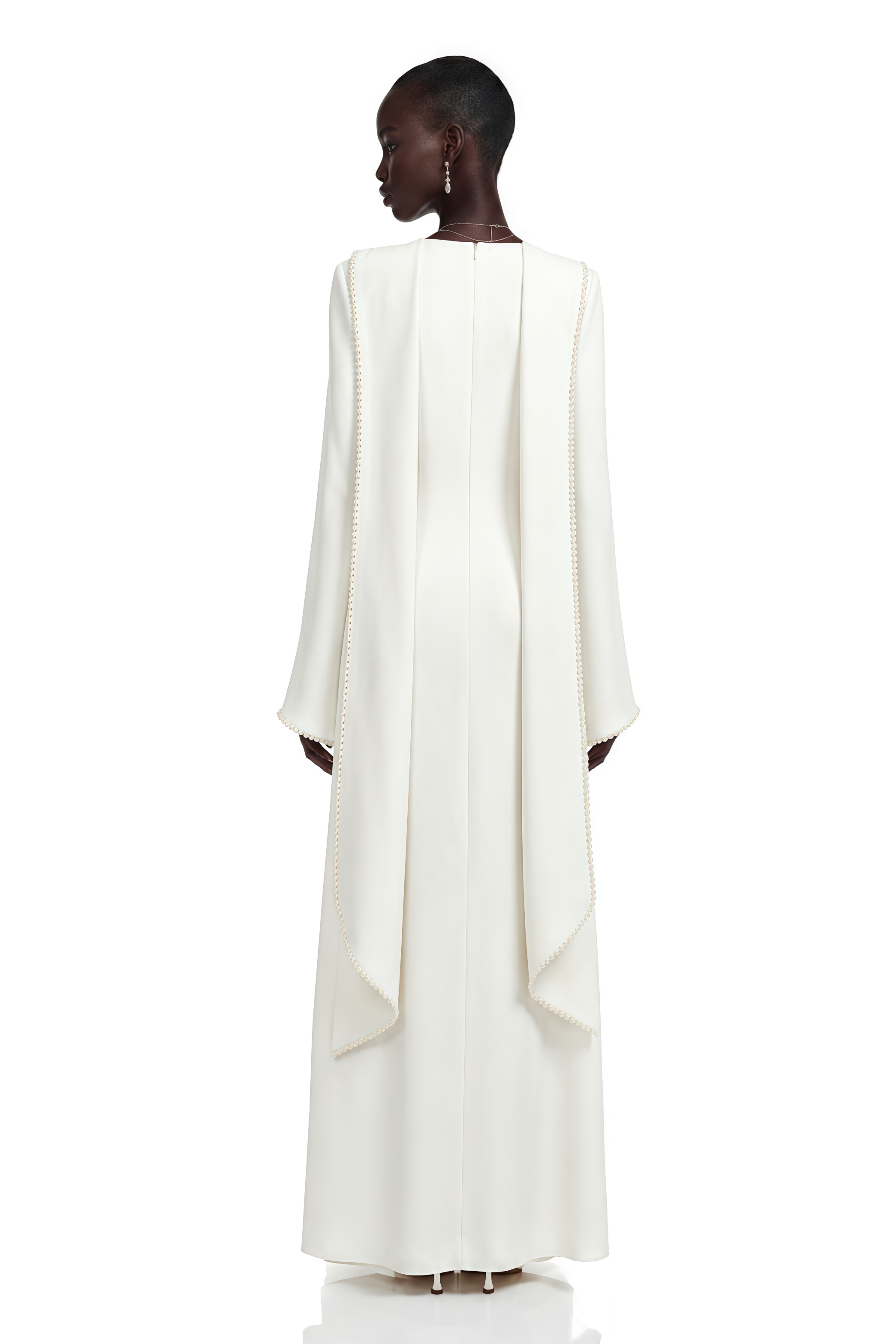 White long-sleeve gown with a high neckline and pearl trim
