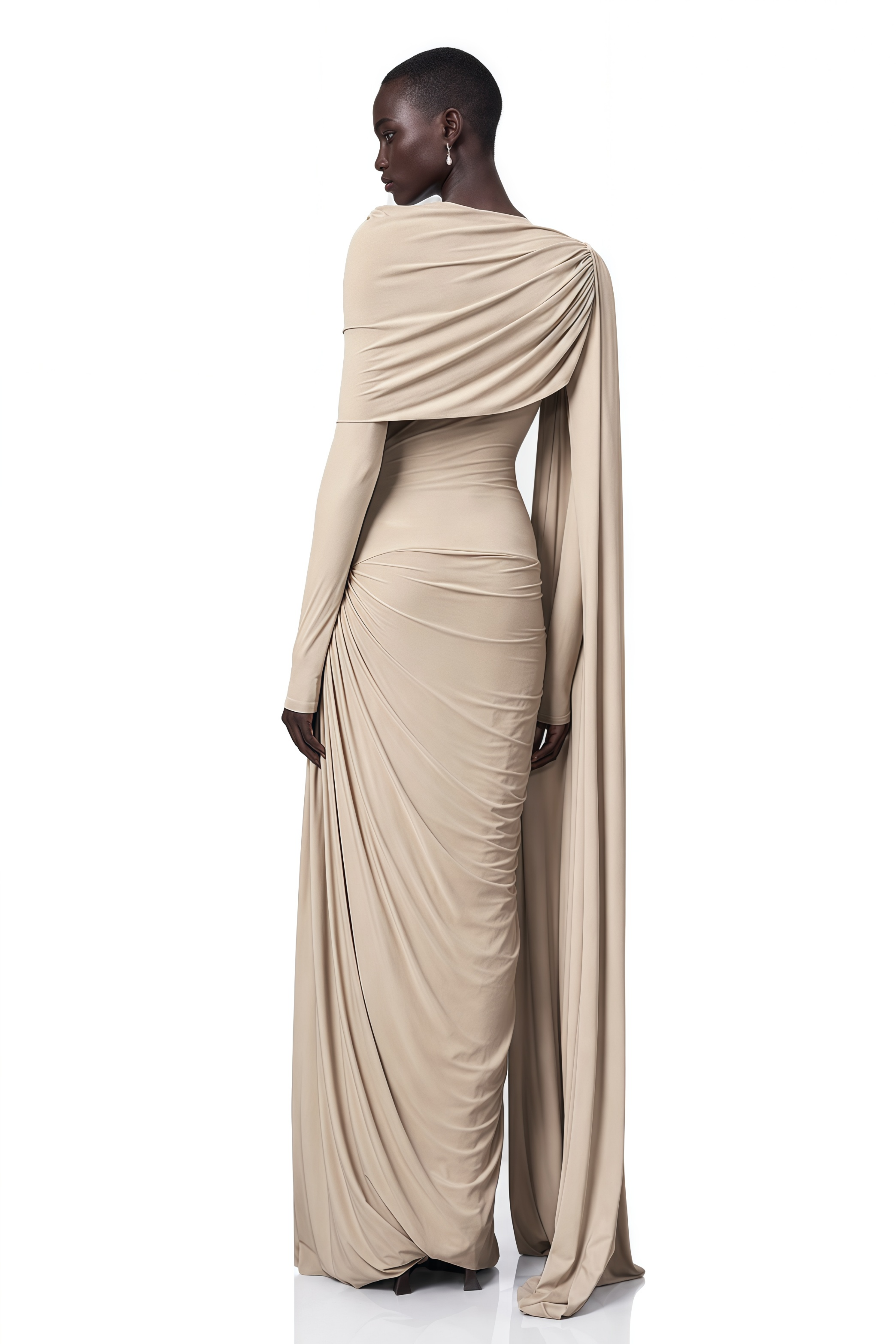 Beige long-sleeve maxi dress with a draped bodice and floor-length cape panel