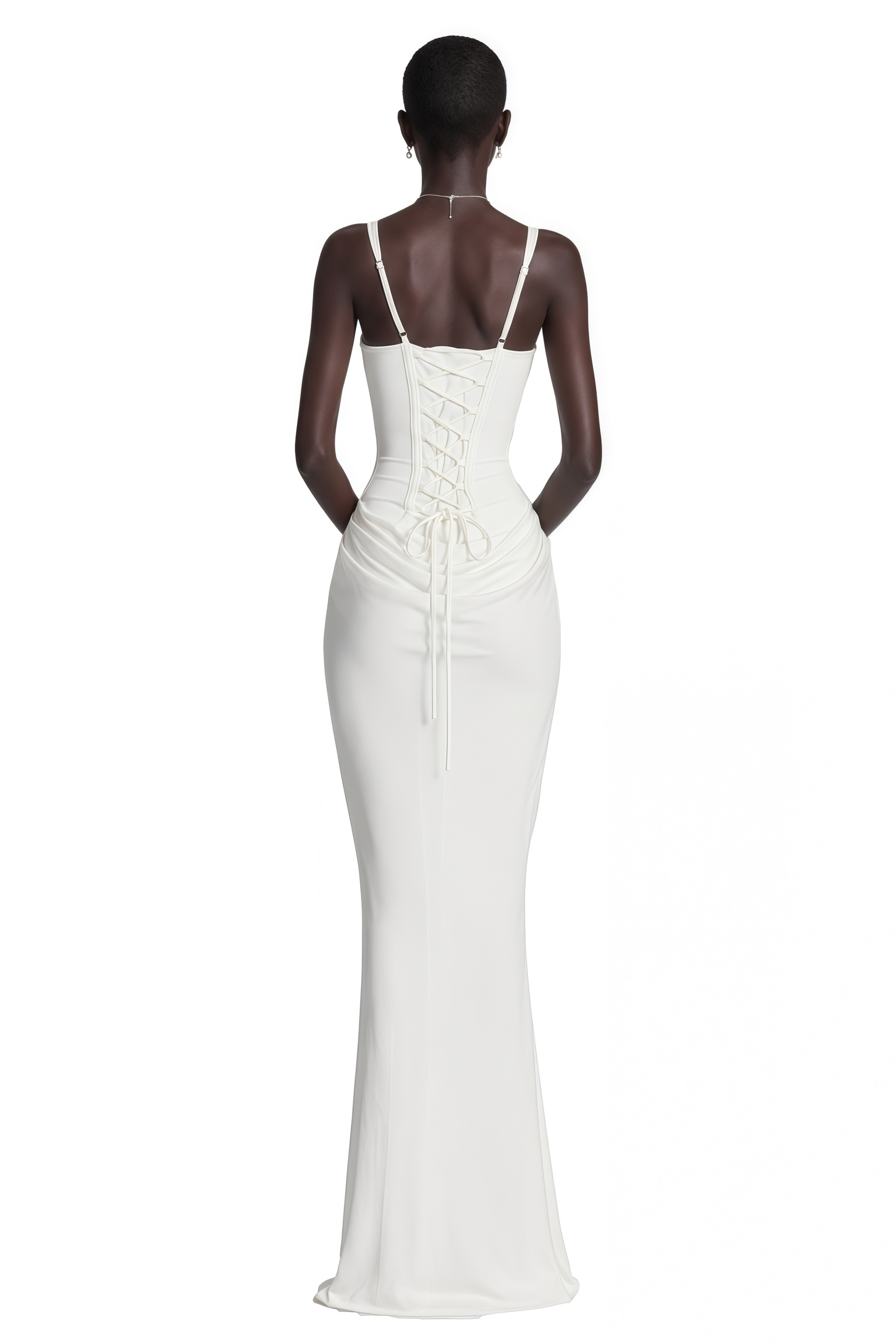 White gown with a corset bodice and a draped waist