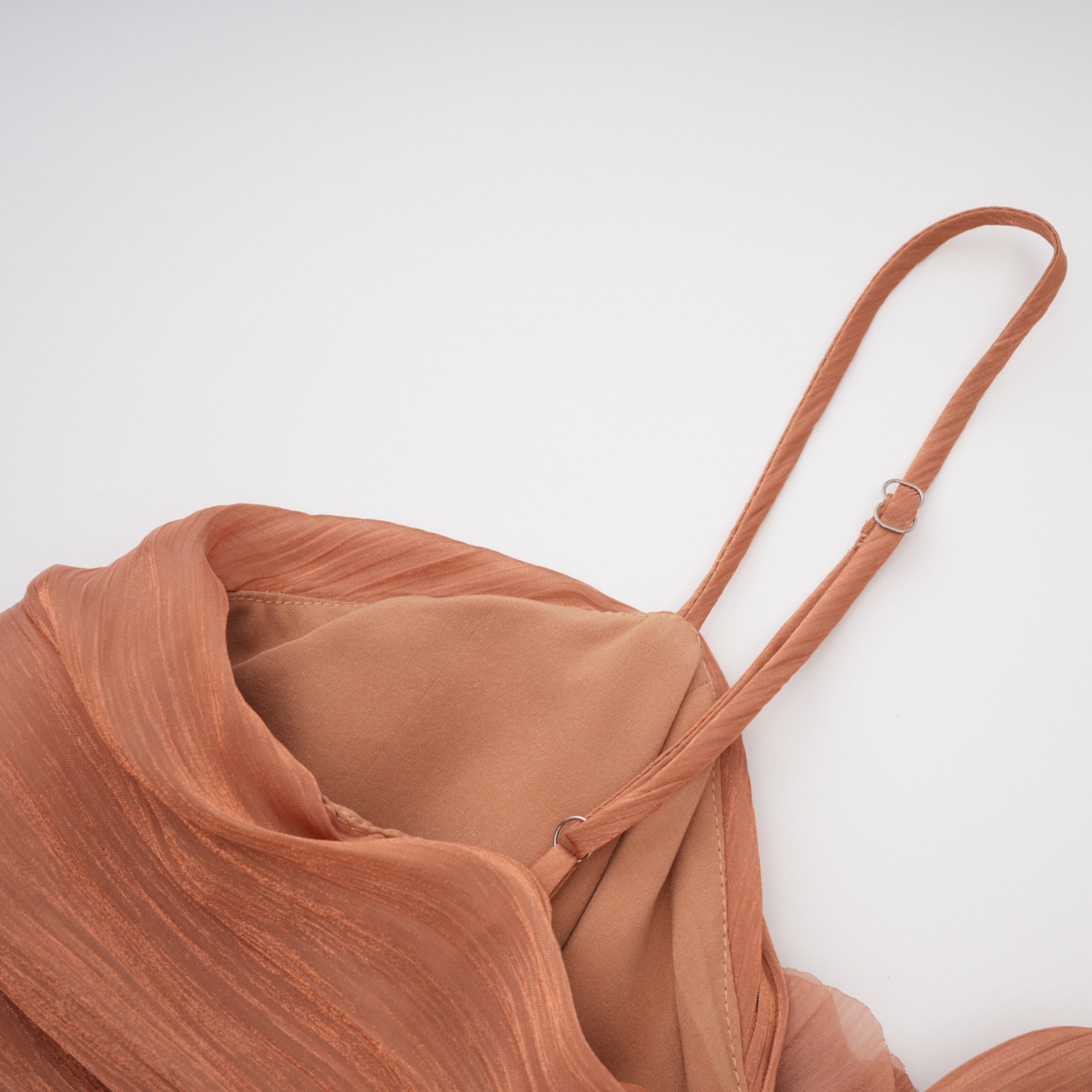 Terracotta gathered cape gown with floral rosettes