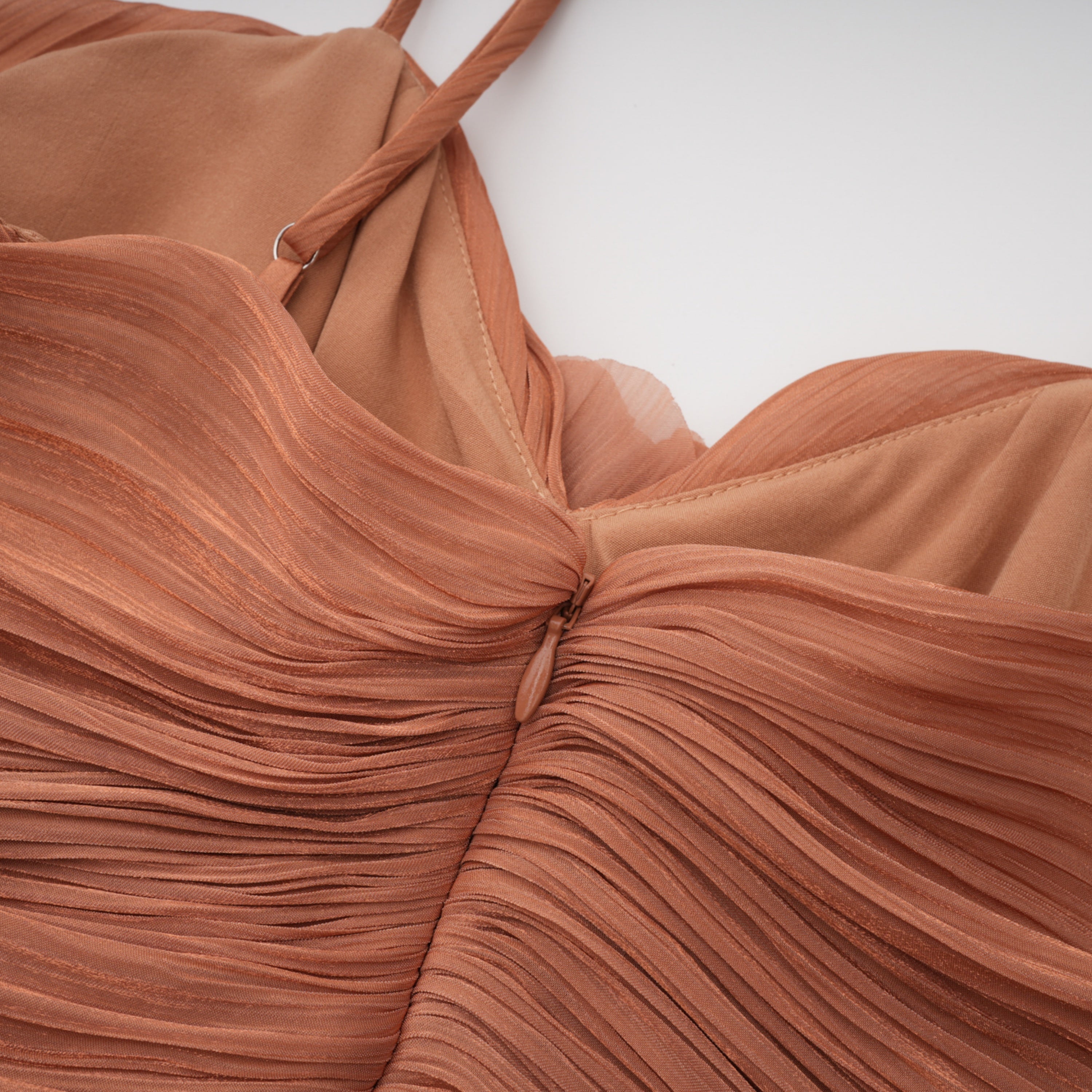 Terracotta gathered cape gown with floral rosettes