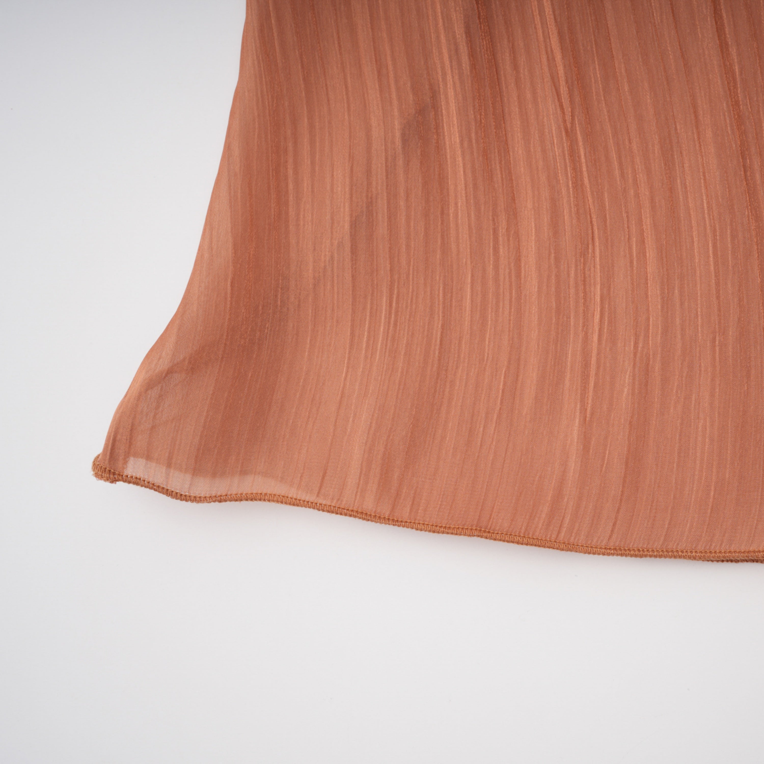 Terracotta gathered cape gown with floral rosettes