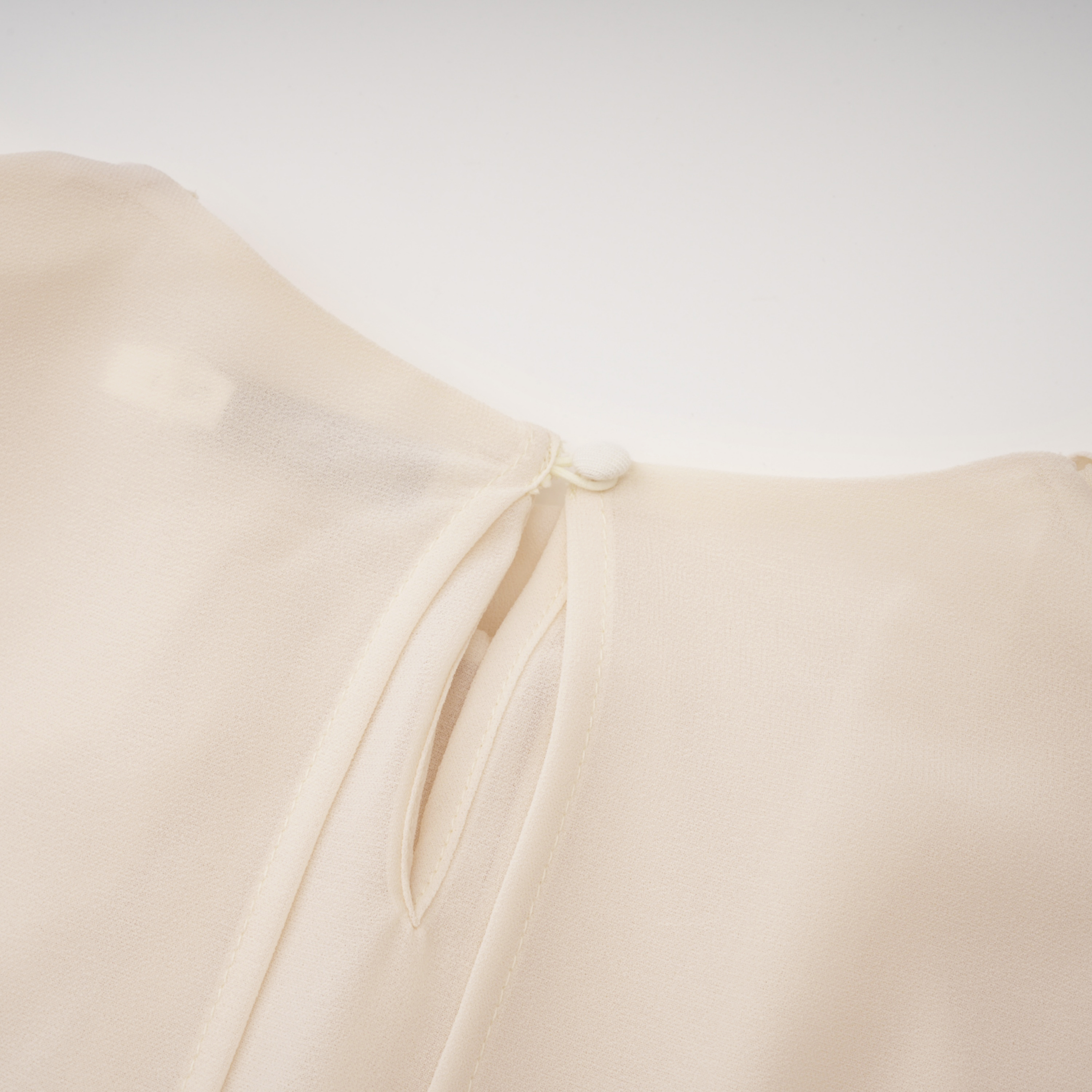 Consuela Neutral Pleated Mini Dress with Lace Trim