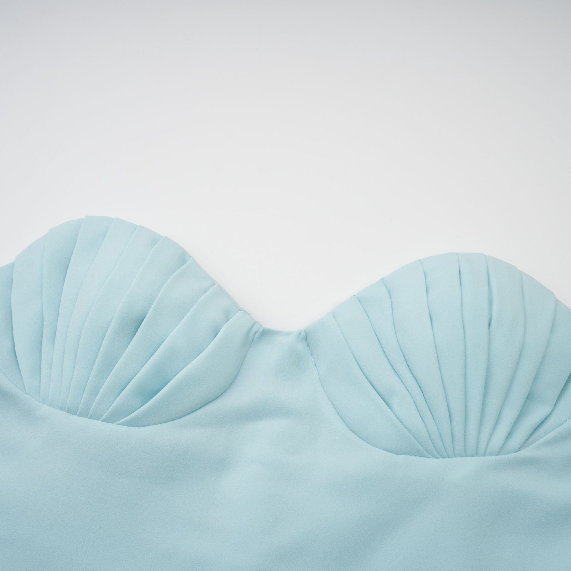 Light blue strapless gown with sweetheart neckline and pleated skirt