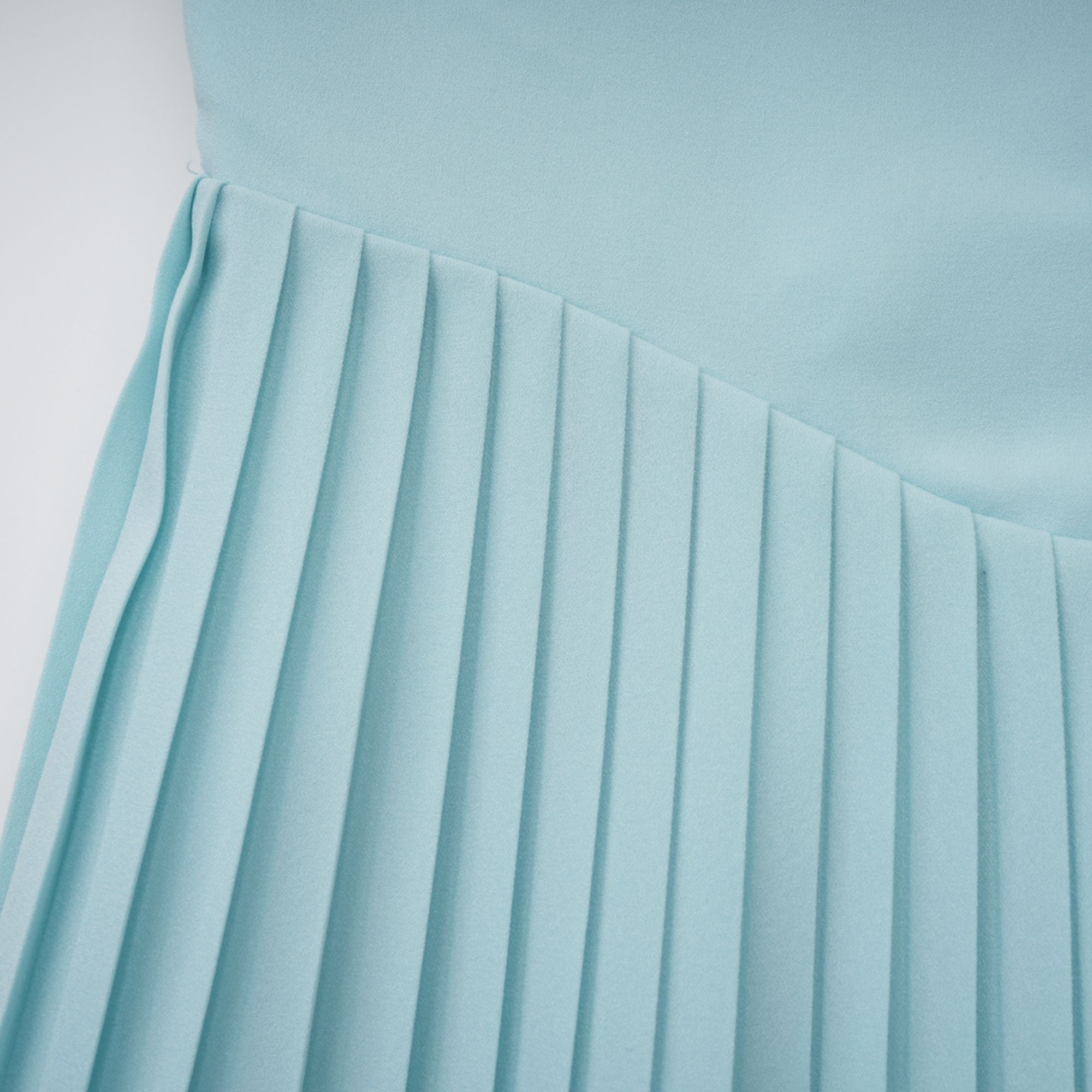 Light blue strapless gown with sweetheart neckline and pleated skirt