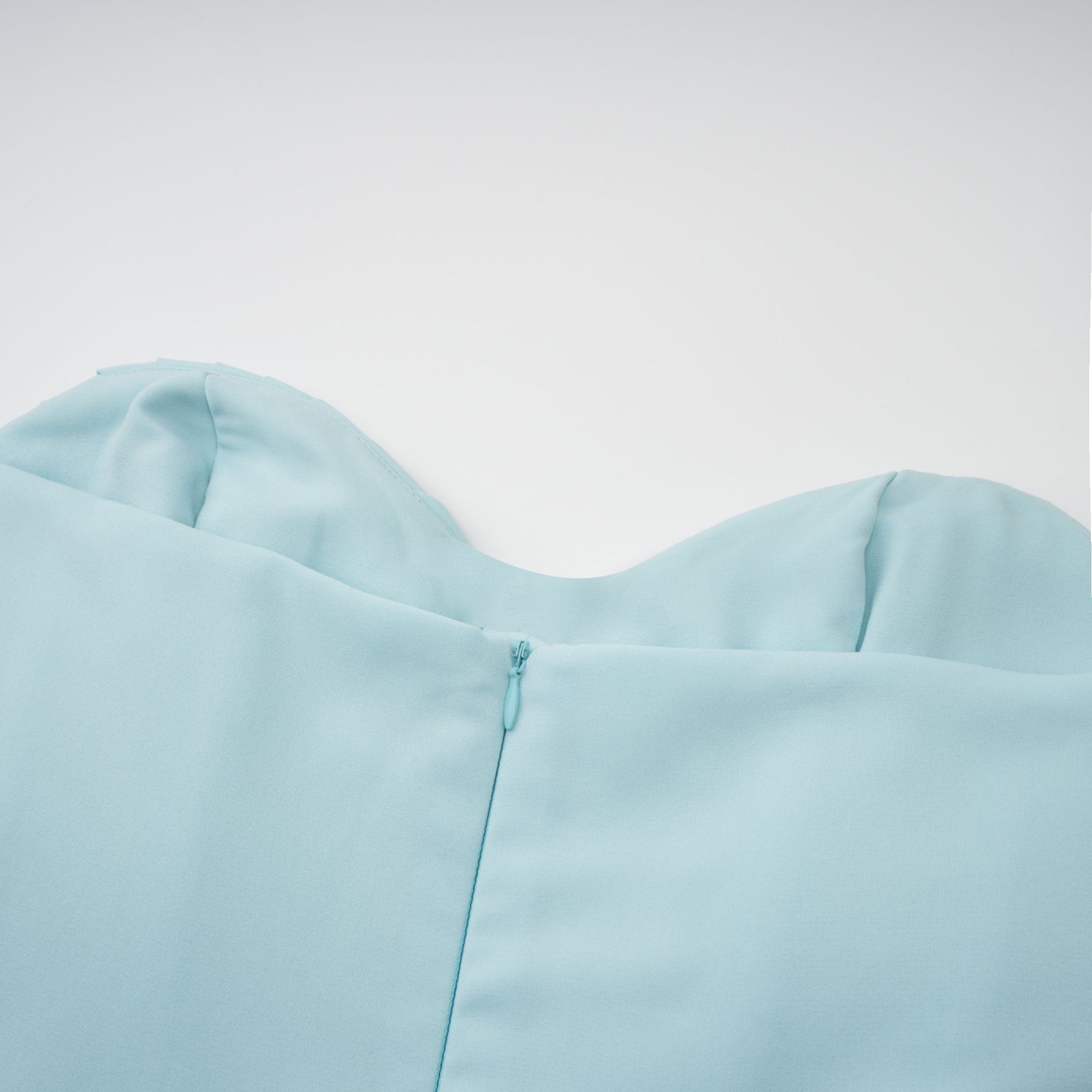 Light blue strapless gown with sweetheart neckline and pleated skirt