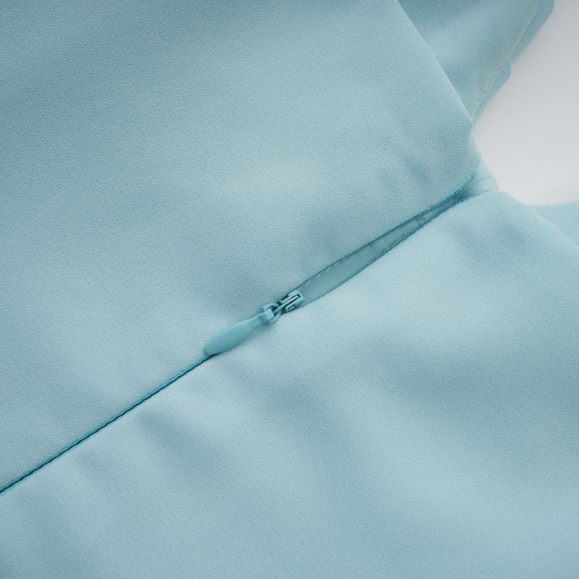 Light blue strapless gown with sweetheart neckline and pleated skirt