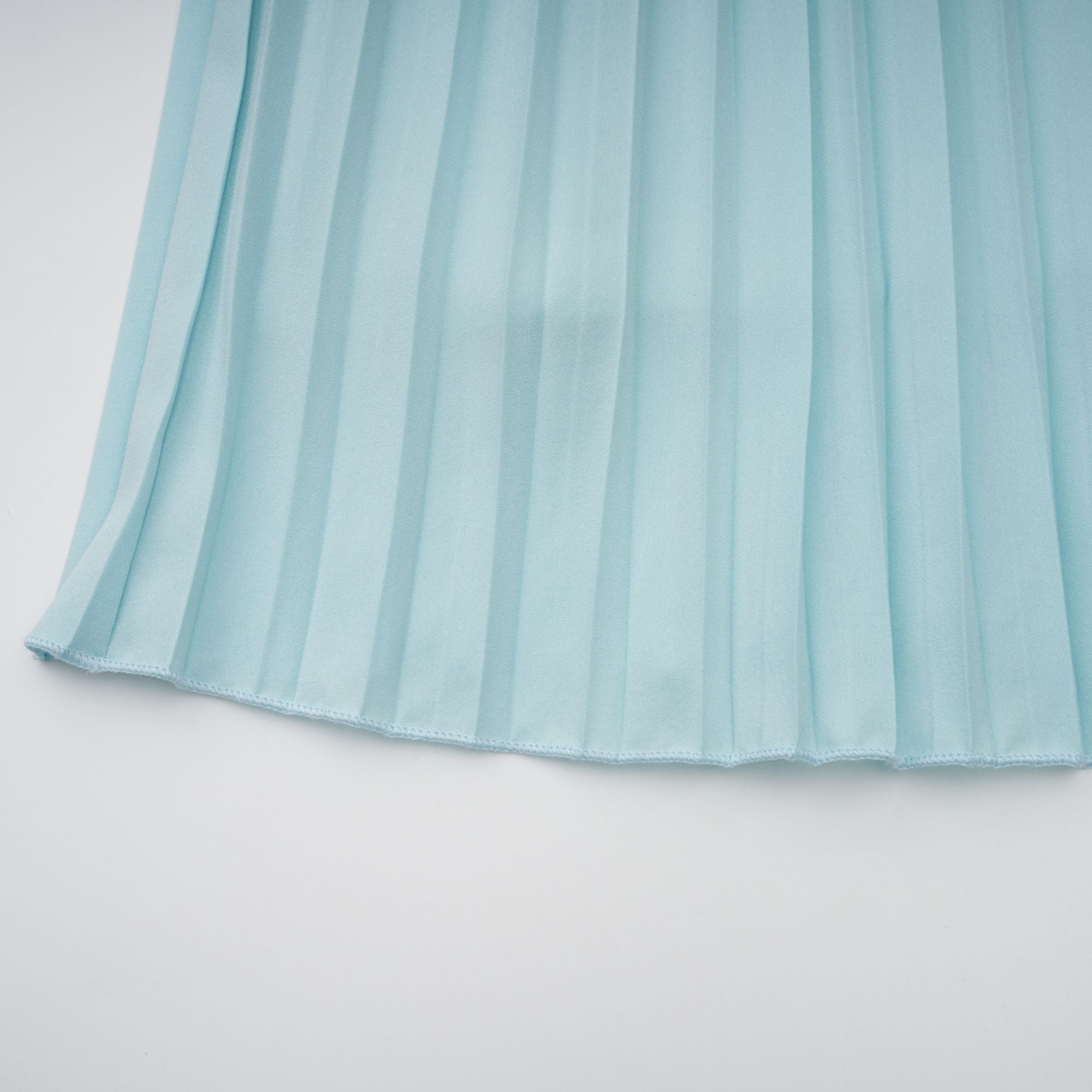 Light blue strapless gown with sweetheart neckline and pleated skirt