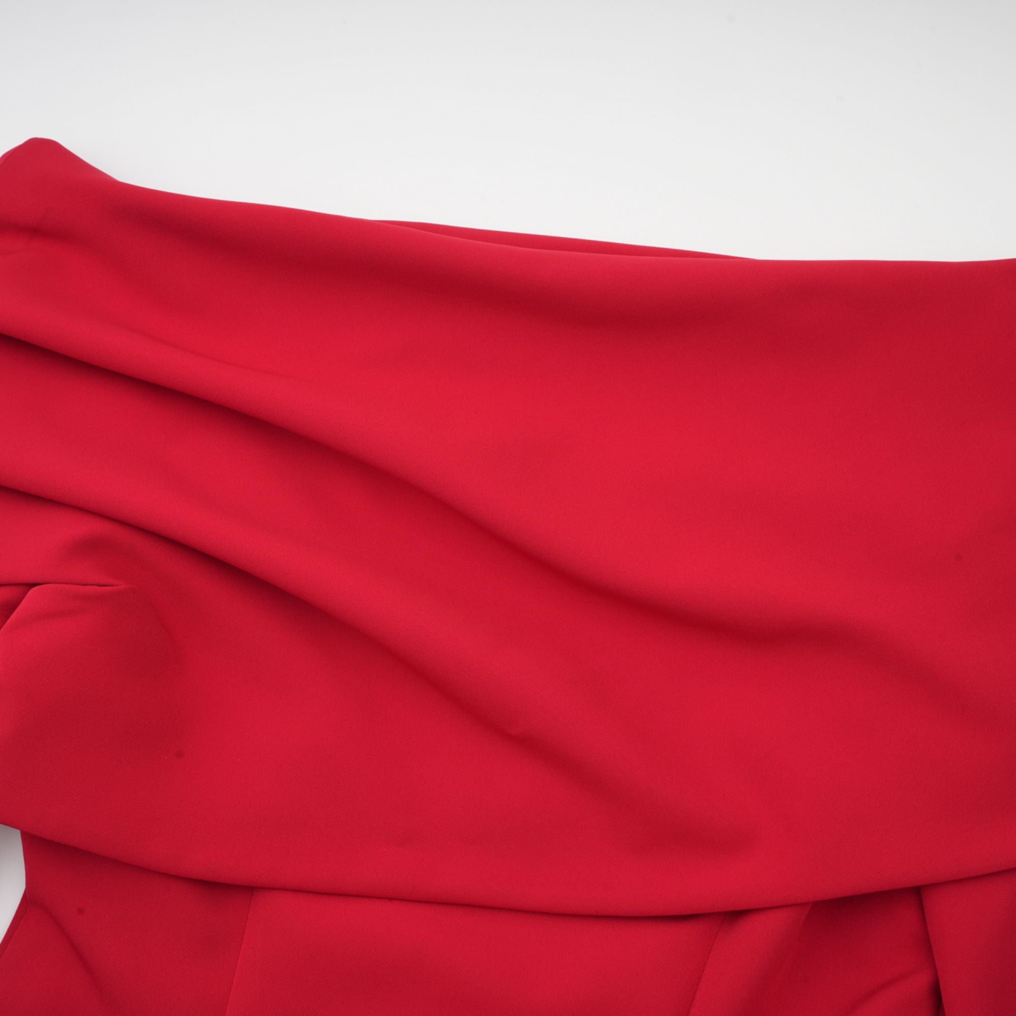 Red off-the-shoulder long-sleeve dress with a pleated skirt panel