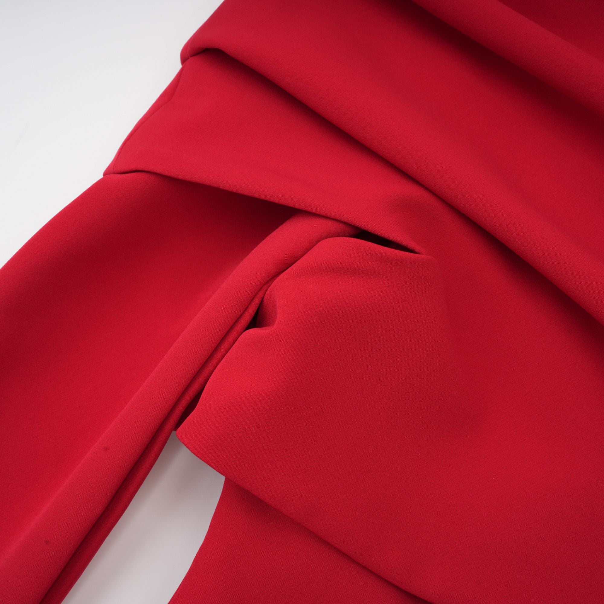 Red off-the-shoulder long-sleeve dress with a pleated skirt panel