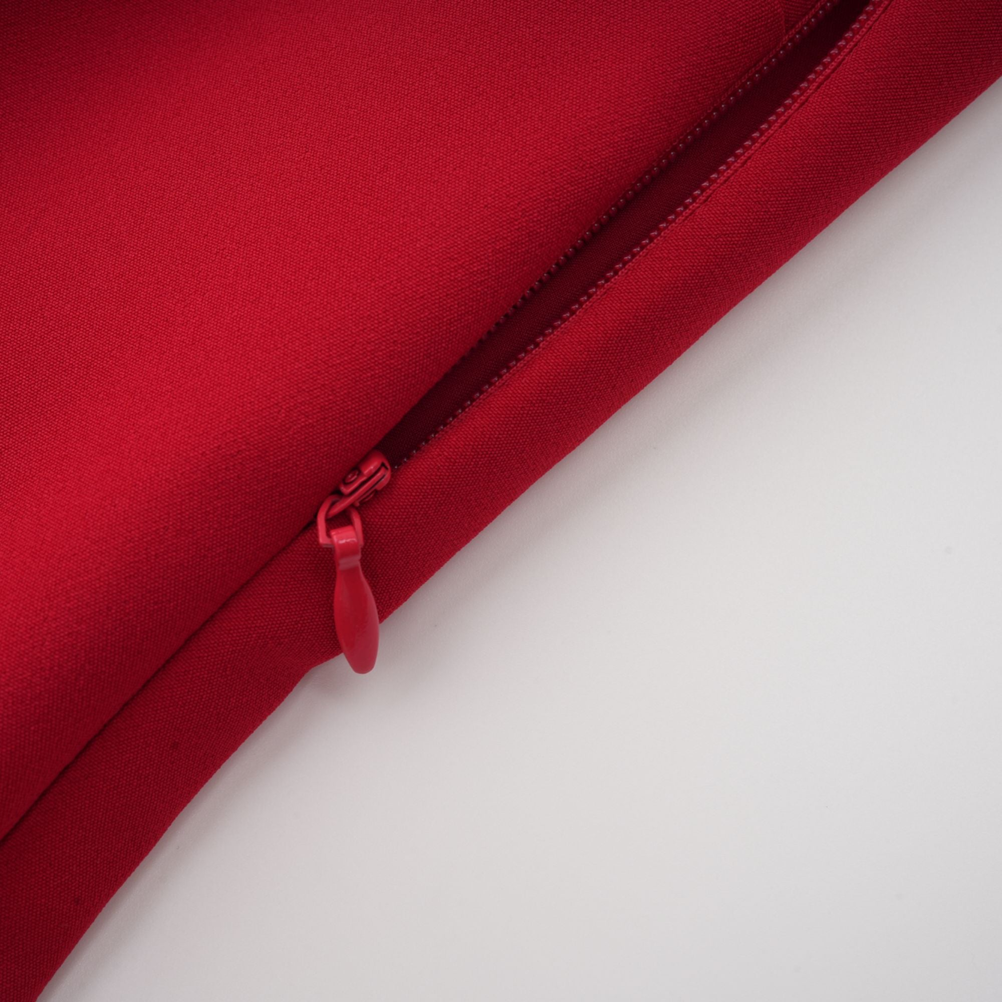 Red off-the-shoulder long-sleeve dress with a pleated skirt panel