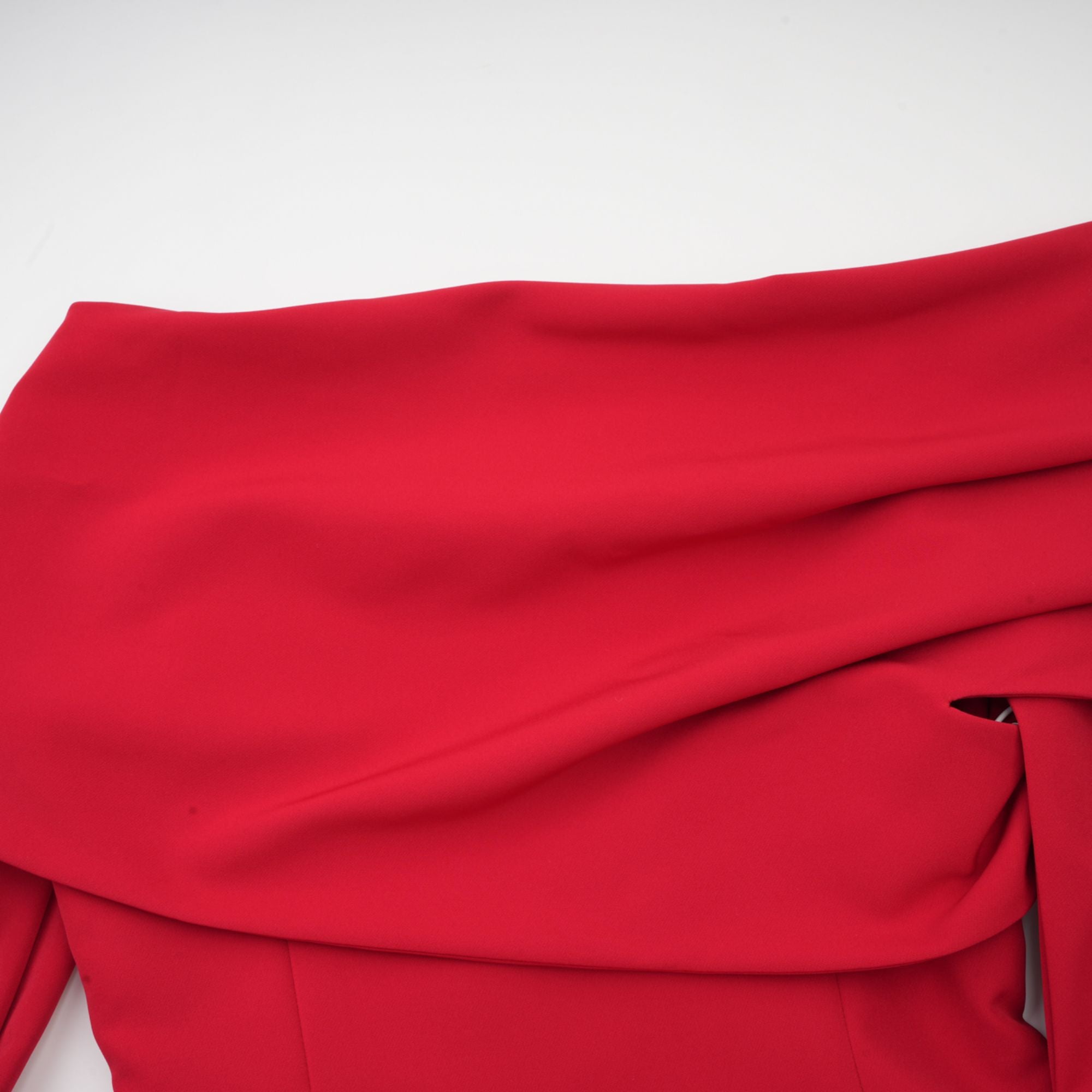 Red off-the-shoulder long-sleeve dress with a pleated skirt panel
