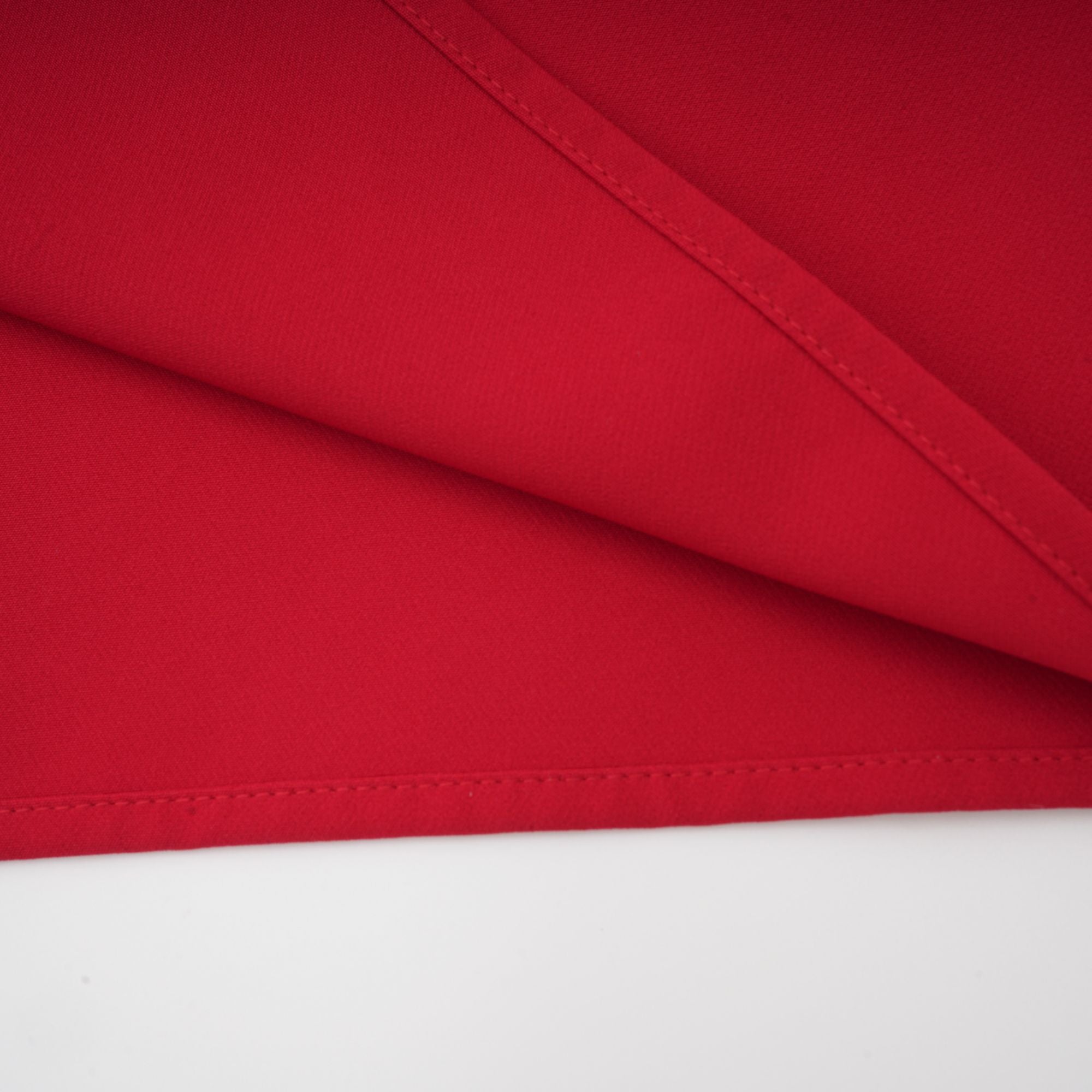 Red off-the-shoulder long-sleeve dress with a pleated skirt panel