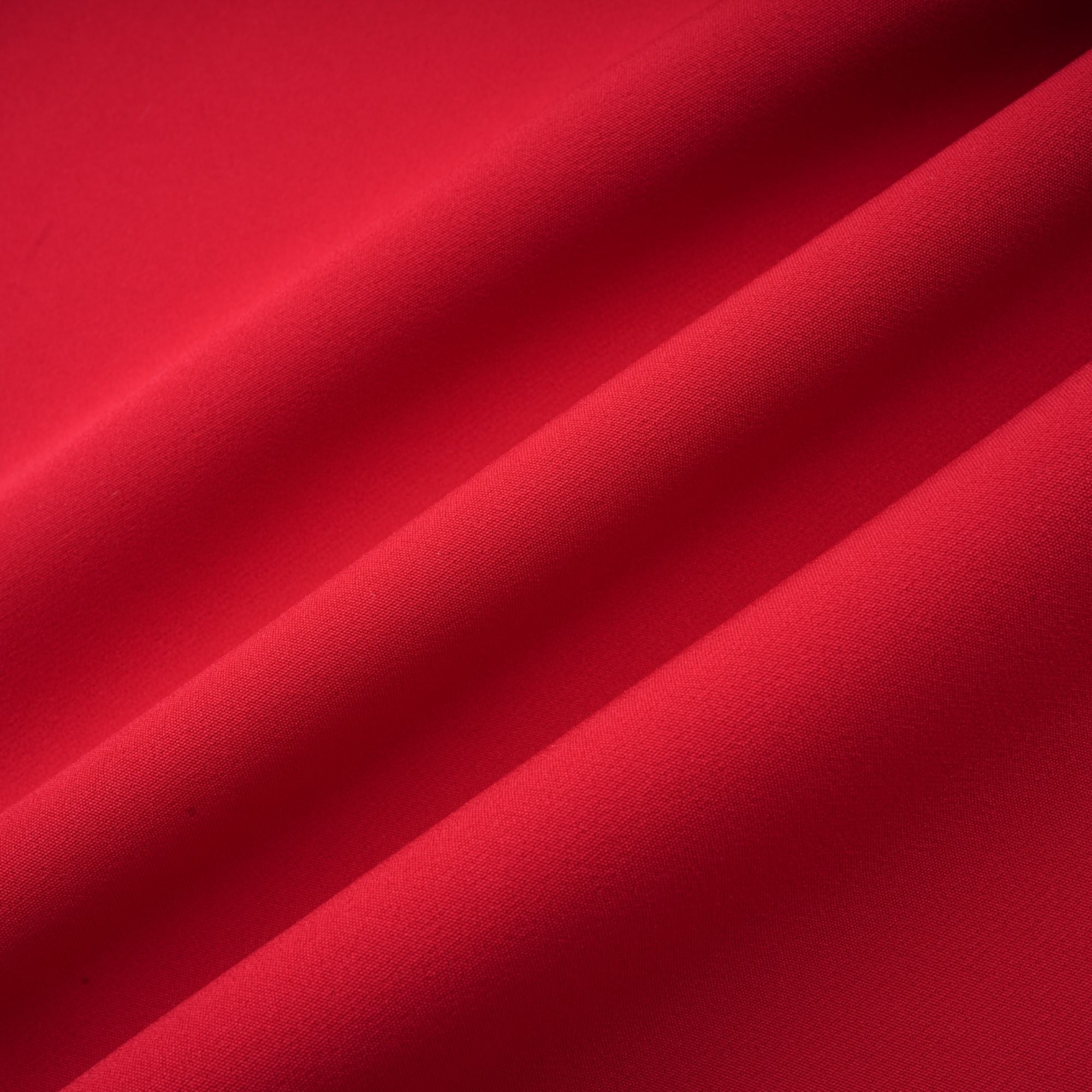 Red off-the-shoulder long-sleeve dress with a pleated skirt panel