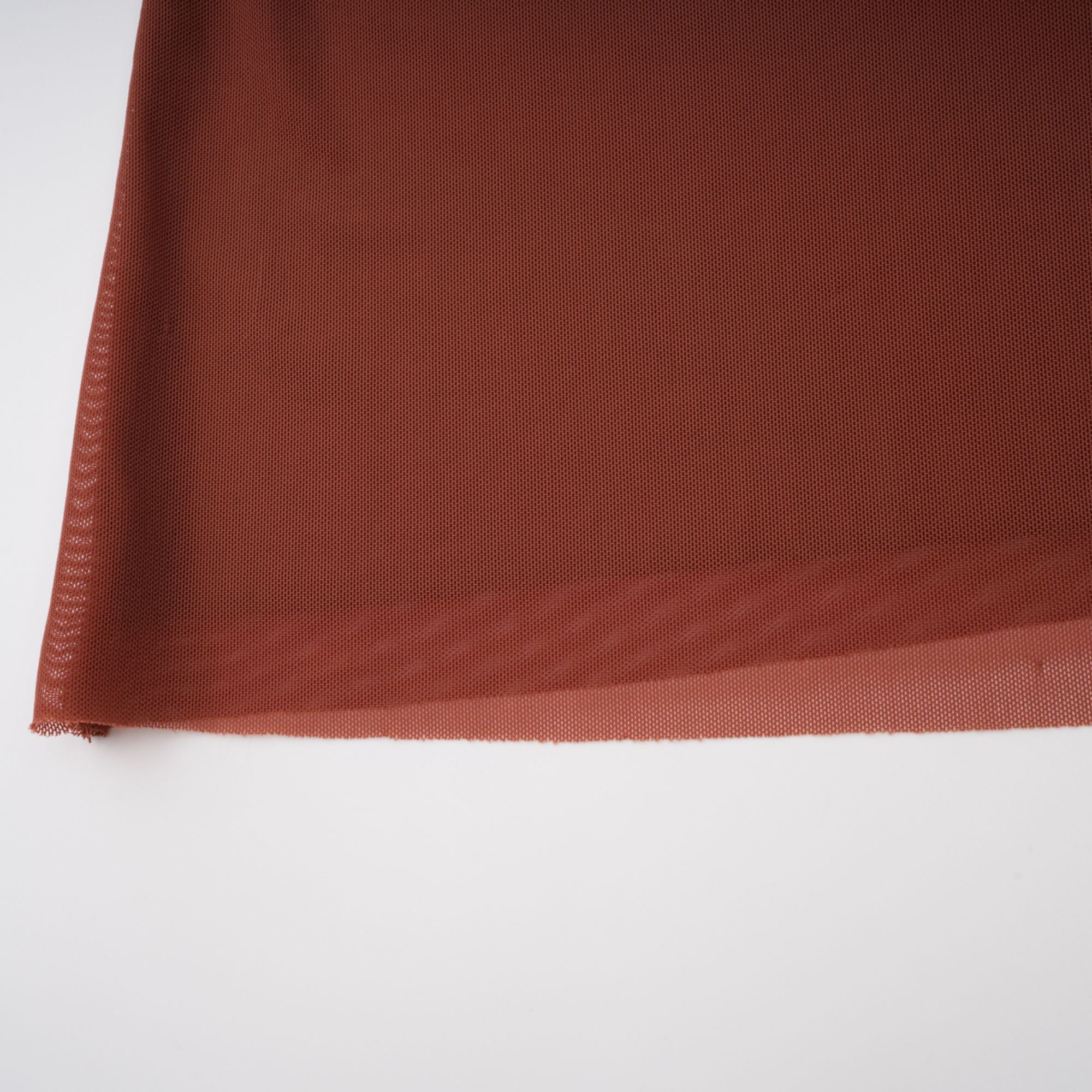Rust-colored long-sleeve maxi dress with a draped cowl neckline and pleated bodice