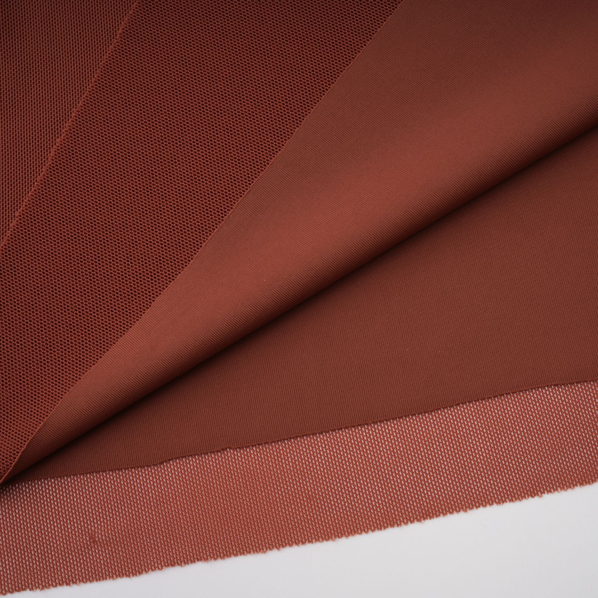 Rust-colored long-sleeve maxi dress with a draped cowl neckline and pleated bodice