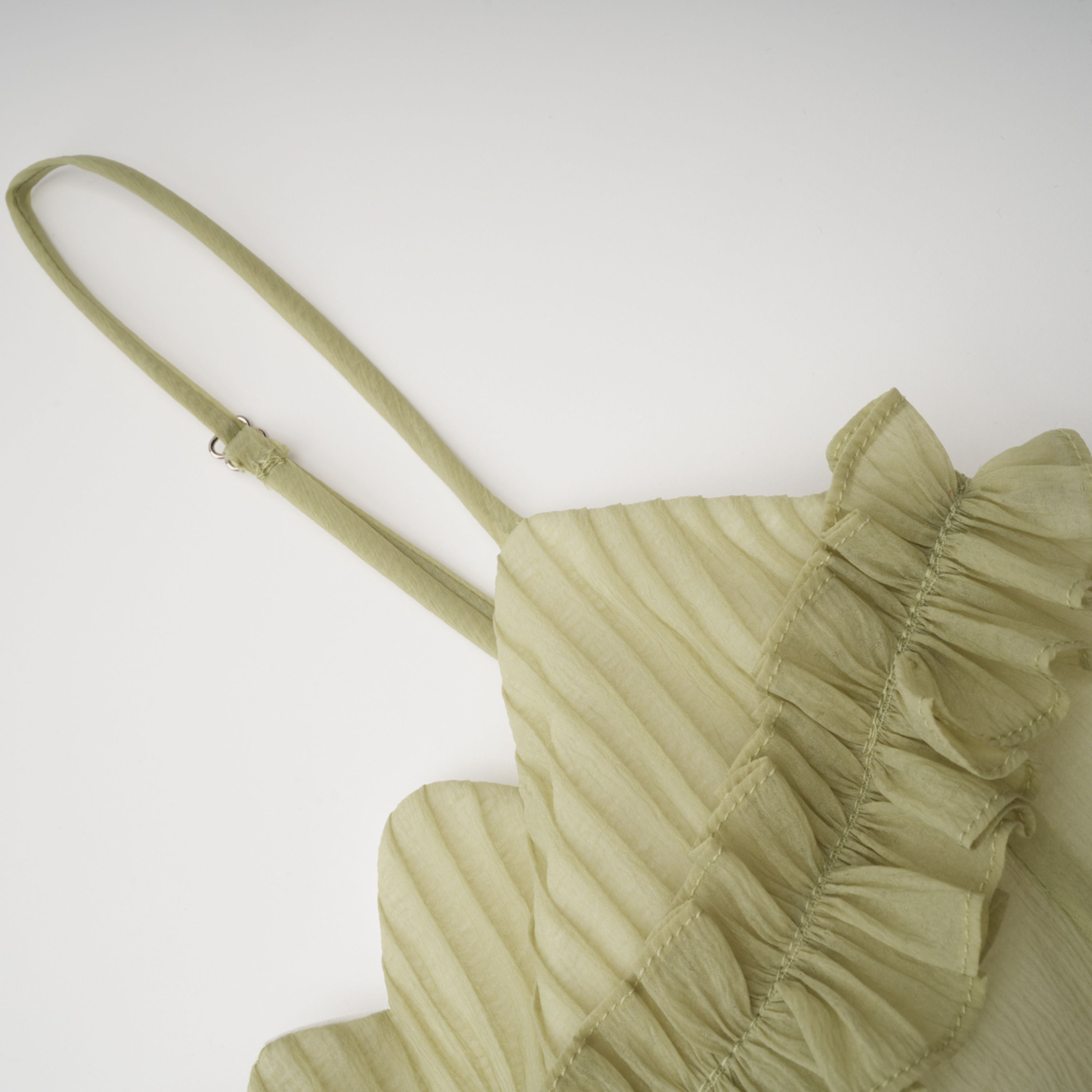 Light green spaghetti strap maxi dress with a ruffled neckline