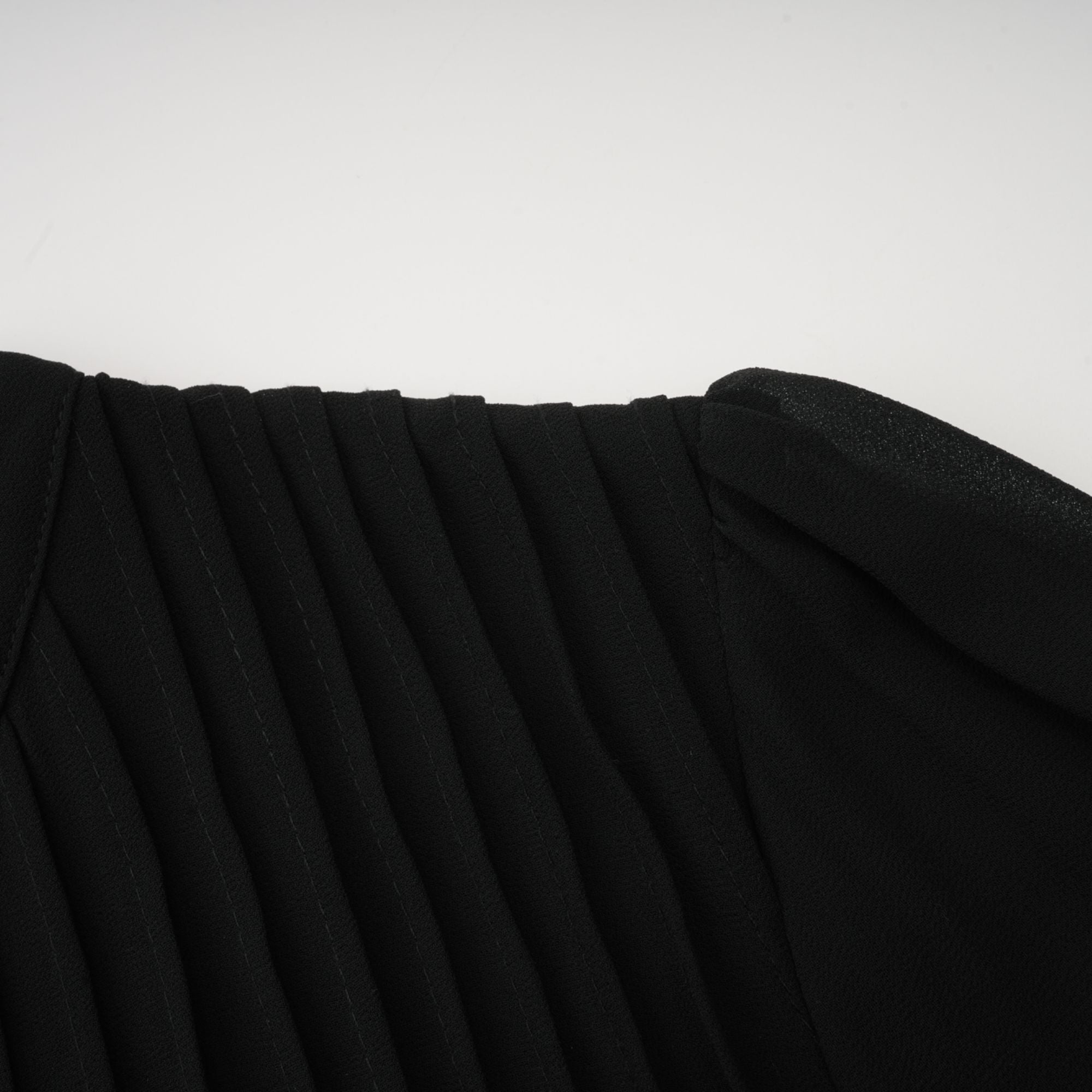 Black pleated midi dress with gold button details