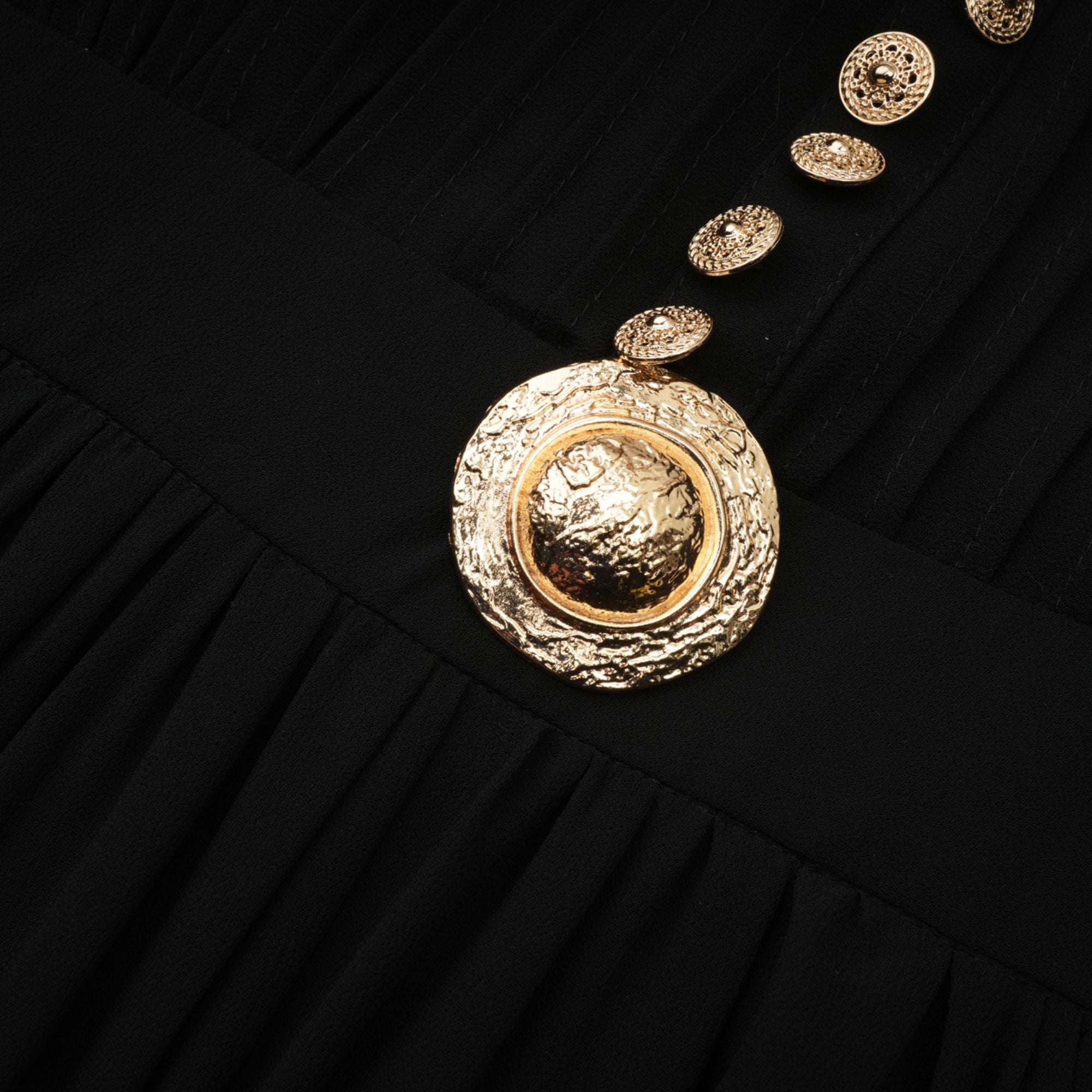 Black pleated midi dress with gold button details
