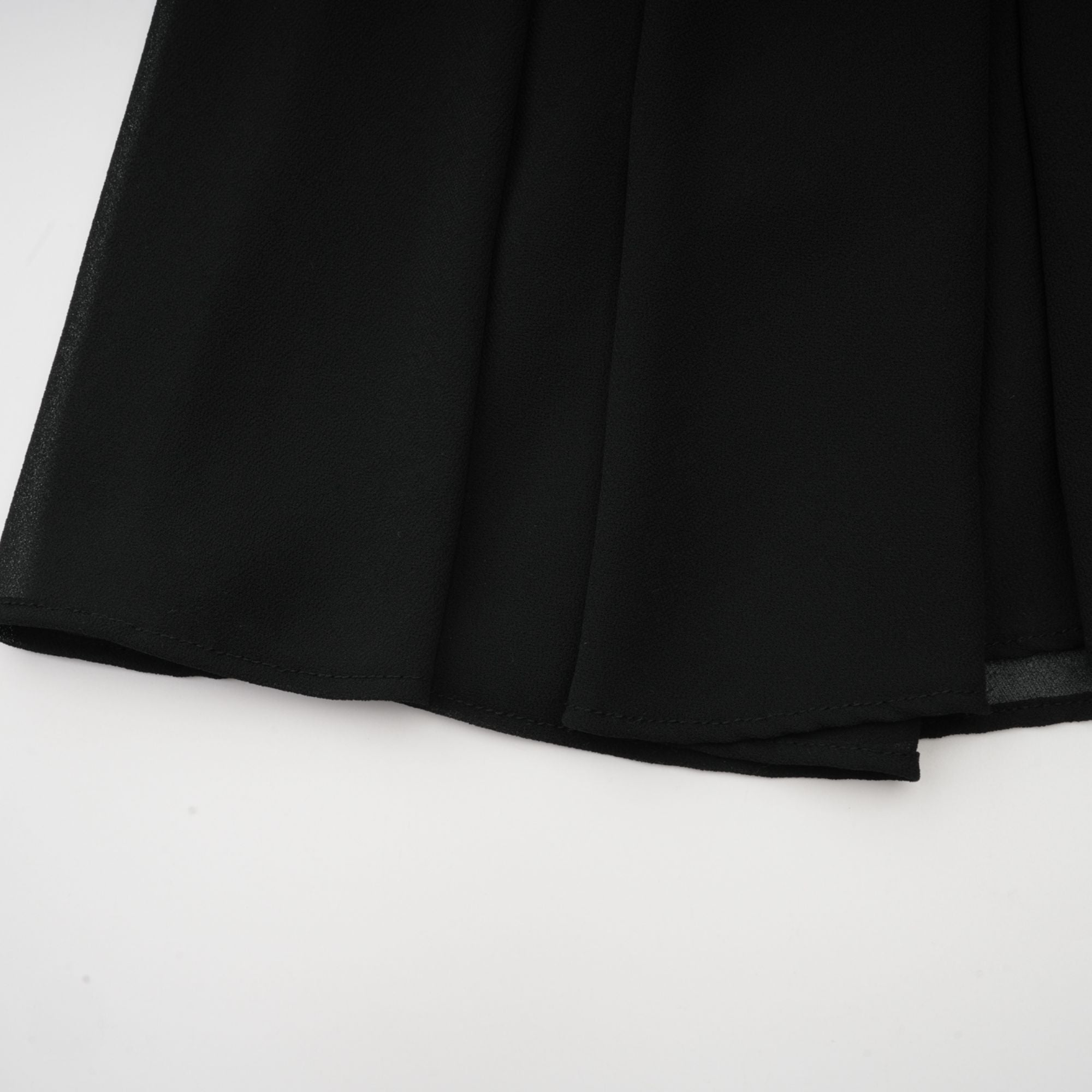 Black pleated midi dress with gold button details