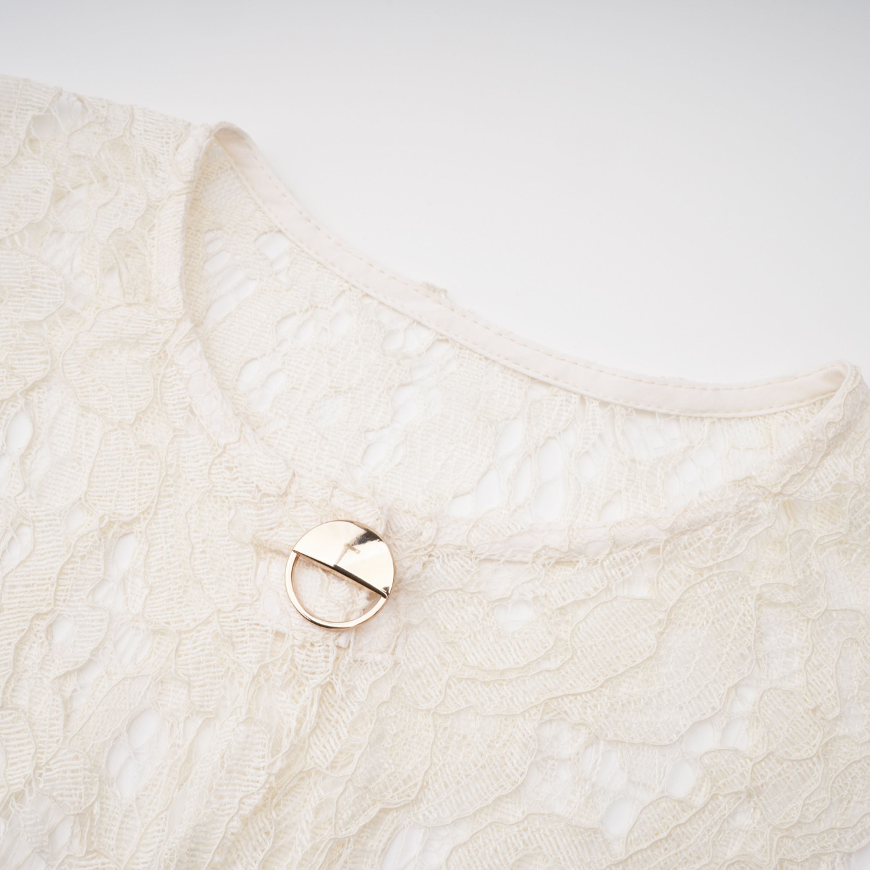White lace midi dress with a keyhole neckline and a flared skirt over a nude lining
