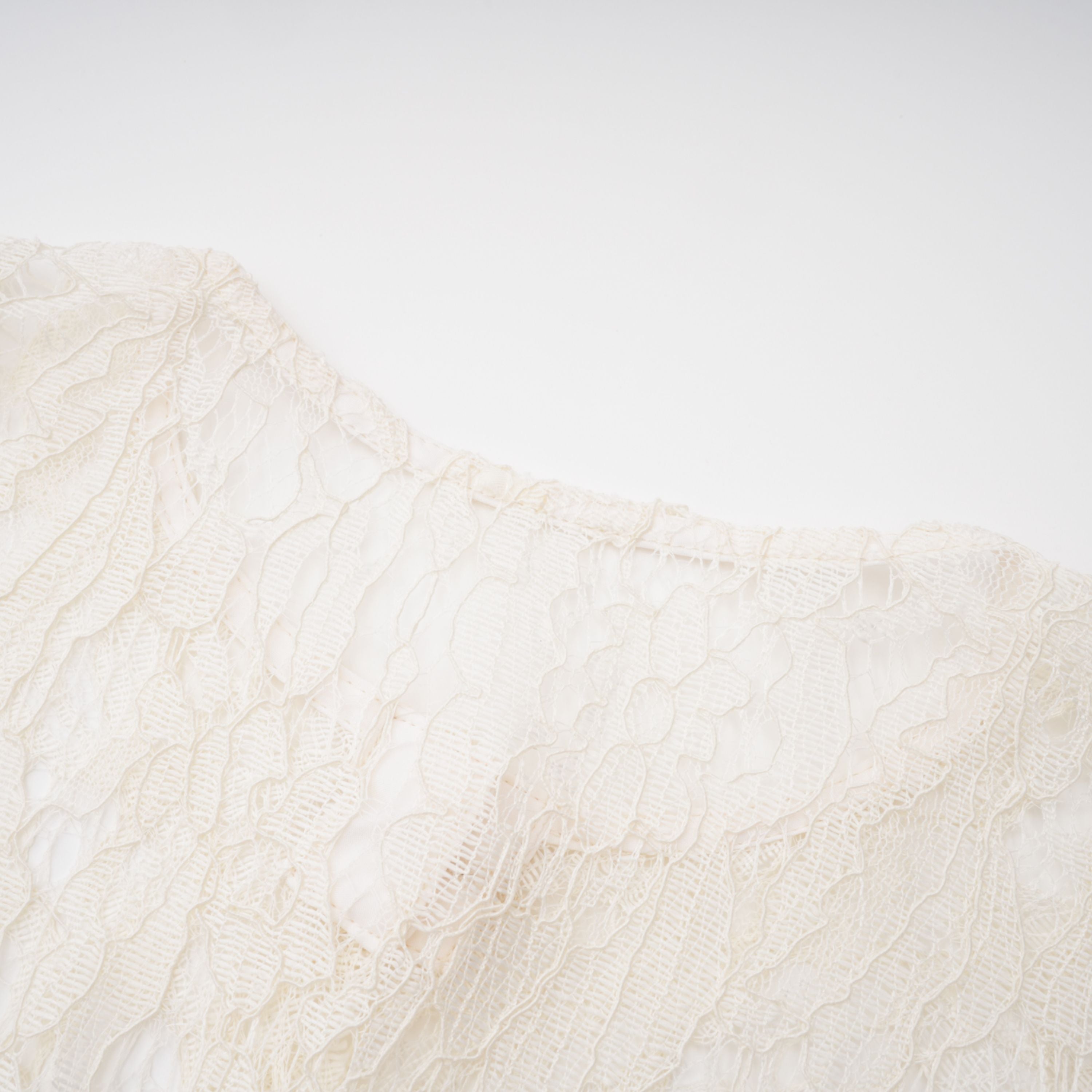 White lace midi dress with a keyhole neckline and a flared skirt over a nude lining
